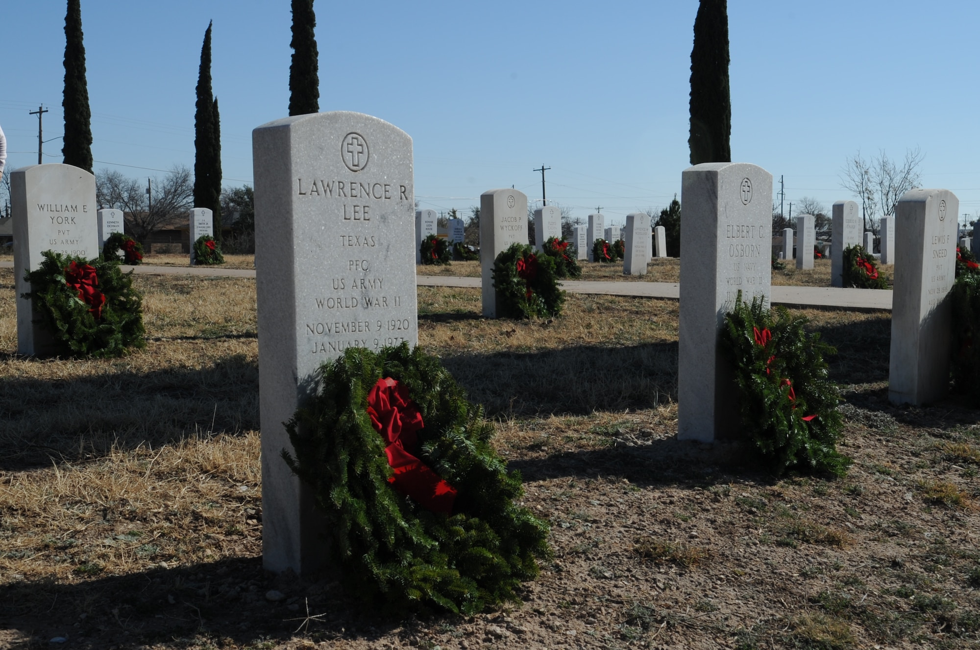 SAN ANGELO, Texas -- Graves of veterans of past and current conflicts wars are addorned with wreaths in recognition of their sacrifices during the Civil Air Patrol's annual Wreaths Across America event at Belvedere Memorial Park, Dec. 10. The tradition of the wreath laying ceremony began at Arlington National Cemetery in 1992 and has grown to more than 600 locations across the nation. (U.S. Air Force photo/Staff Sgt. Laura R. McFarlane)