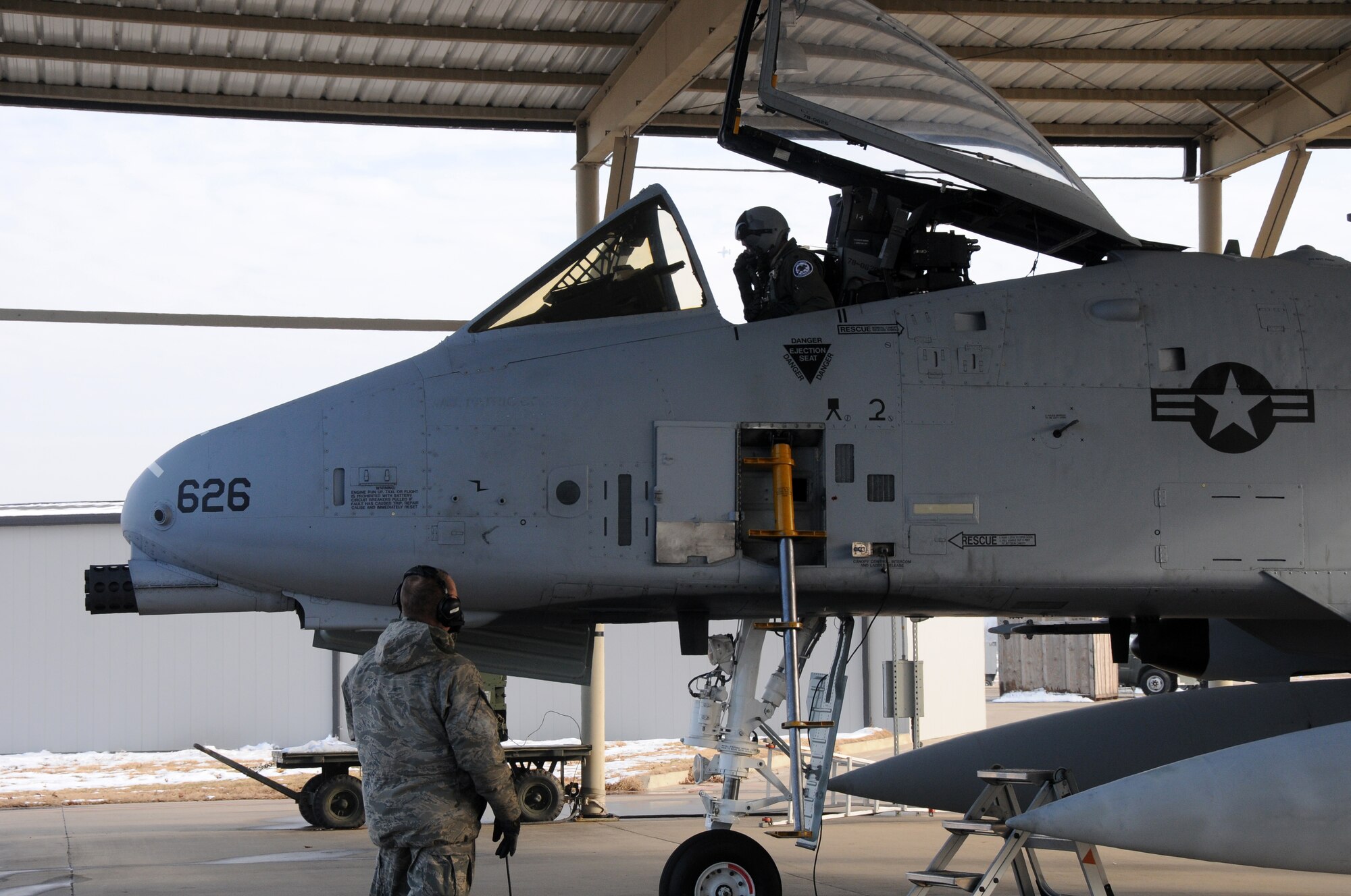 Lt. Col. Rob Myer, a pilot with the Indiana Air National Guard's 122nd Fighter Wing, and Master Sgt. Michael Posey, a crew chief with the 188th Fighter Wing, conduct preflight inspections at Ebbing Air National Guard Base, Fort Smith, Ark., Dec. 11,2013. Myer is delivering one of two A-10C Thunderbolt II "Warthogs" to Fort Wayne, Ind., as part of the188th’s on-going conversion from a fighter mission to remotely piloted aircraft and Intelligence mission, which will include a space-focused targeting squadron. (U.S. Air National Guard photo by Senior Airman John Hillier/188th Fighter Wing Public Affairs)