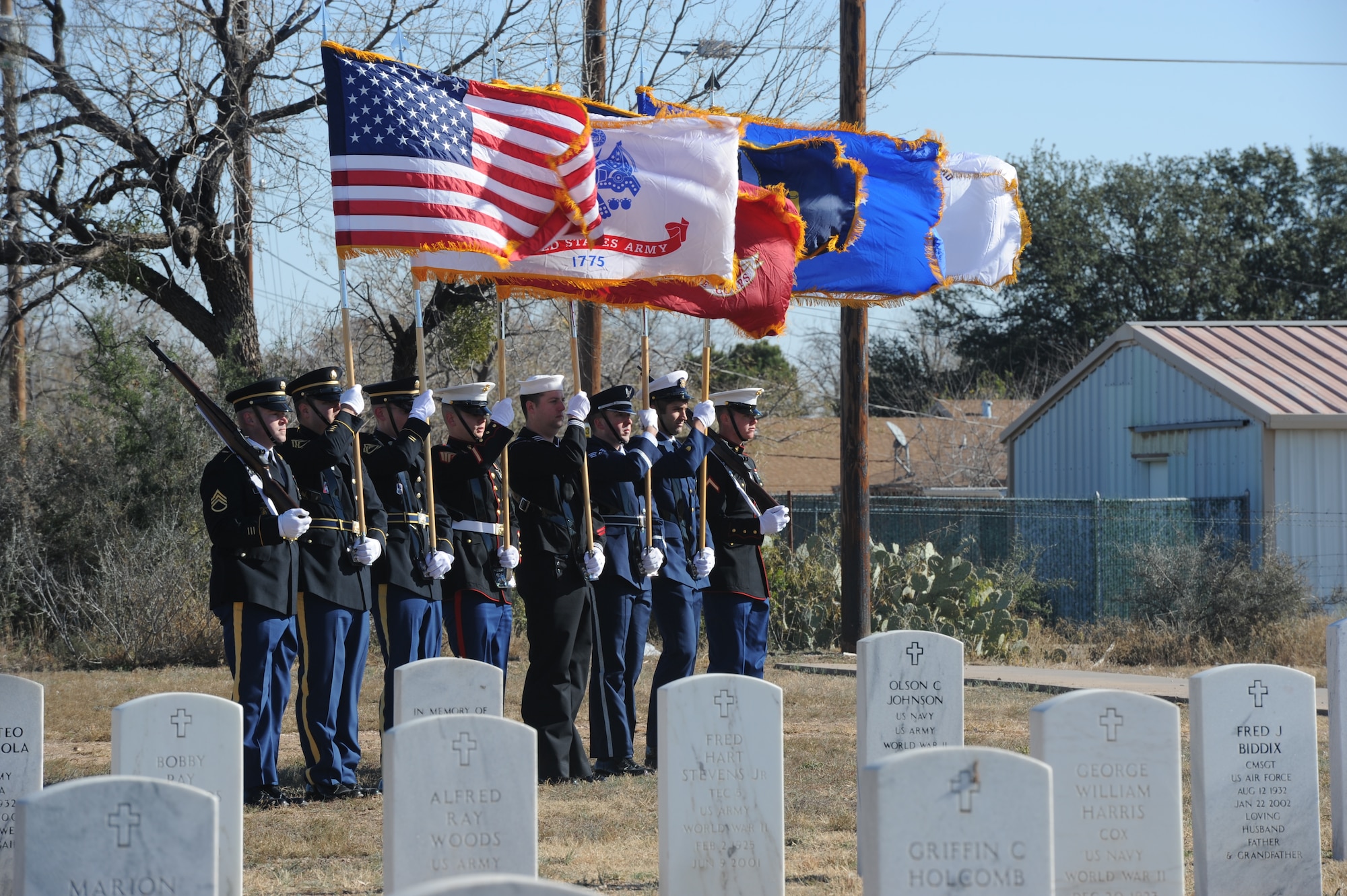 SAN ANGELO, Texas – The Goodfellow Joint Service Color Guard posts the colors during the Wreaths Across America event at the Belvedere Cemetery Dec. 14. The San Angelo Composite Squadron Civil Air Patrol hosted this event honoring deceased service members and their families. (U.S. Air Force photo/ Staff Sgt. Laura R. McFarlane)