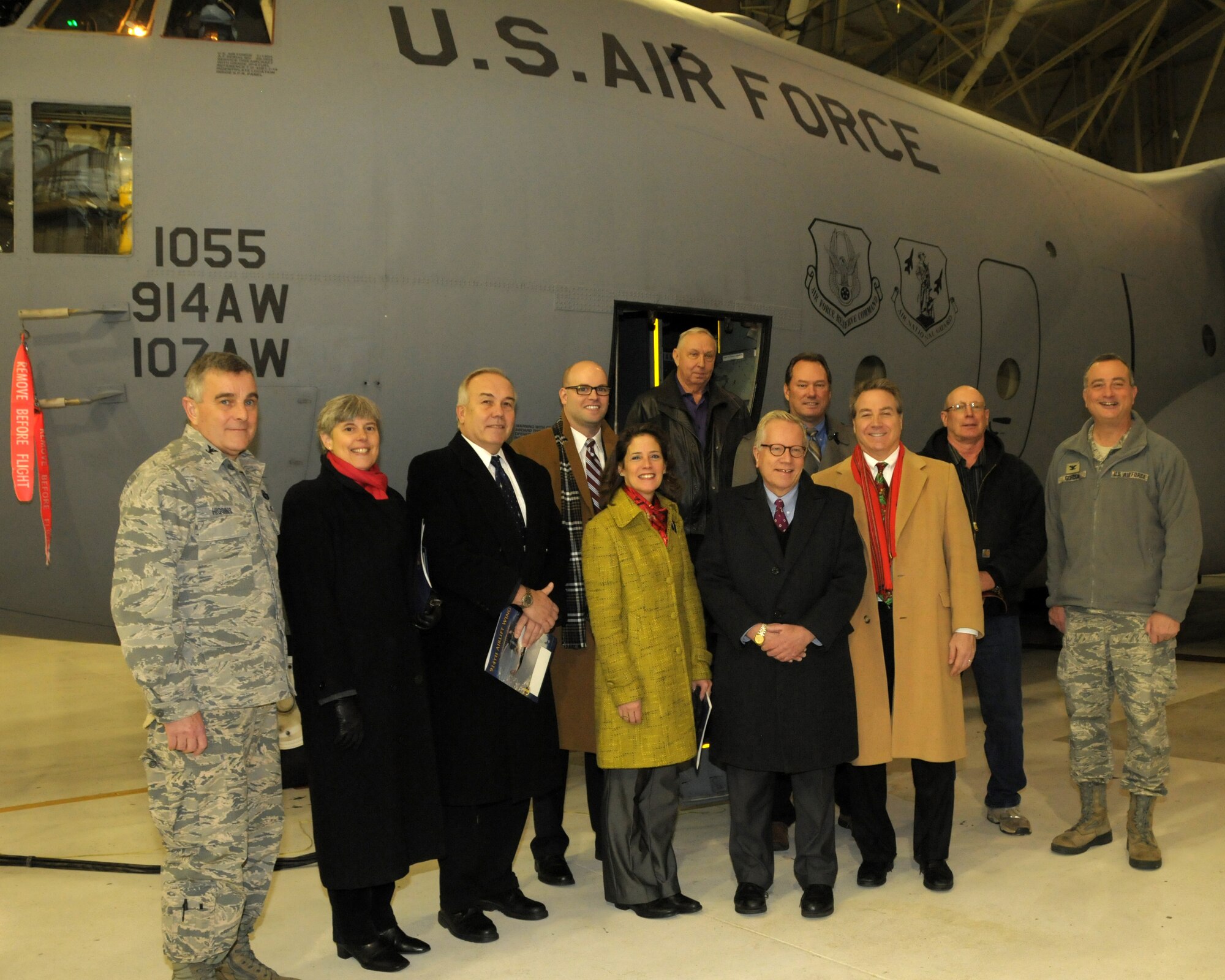 Col. John Higgins,(left) Commander 107th Airlift Wing, and Col. Walter Gordon,(far right) Commander 914th Airlift Wing pose for a group photo with some elected, civic and business leaders in front of a C-130 aircraft at the Niagara Falls Air Reserve Station on December 17, 2013. Local, state and federal legislative and or staff members as well as other local leaders and retired military received a mission briefing by Commanders of the 914th and 107th Airlift Wings as well as a legislative update by the Niagara Military Affairs Council. The event also included a brief tour of the base facilities and the C-130 aircraft. The Niagara Falls Air Reserve Station is home to the 914th and 107th Airlift Wings, the Military Entrance Processing Station and Army Reserve and National Guard units.  The base employs over 3,500 personnel and is indirectly responsible for creating hundreds of jobs in western New York. (U.S. Air Force photo by Peter Borys)