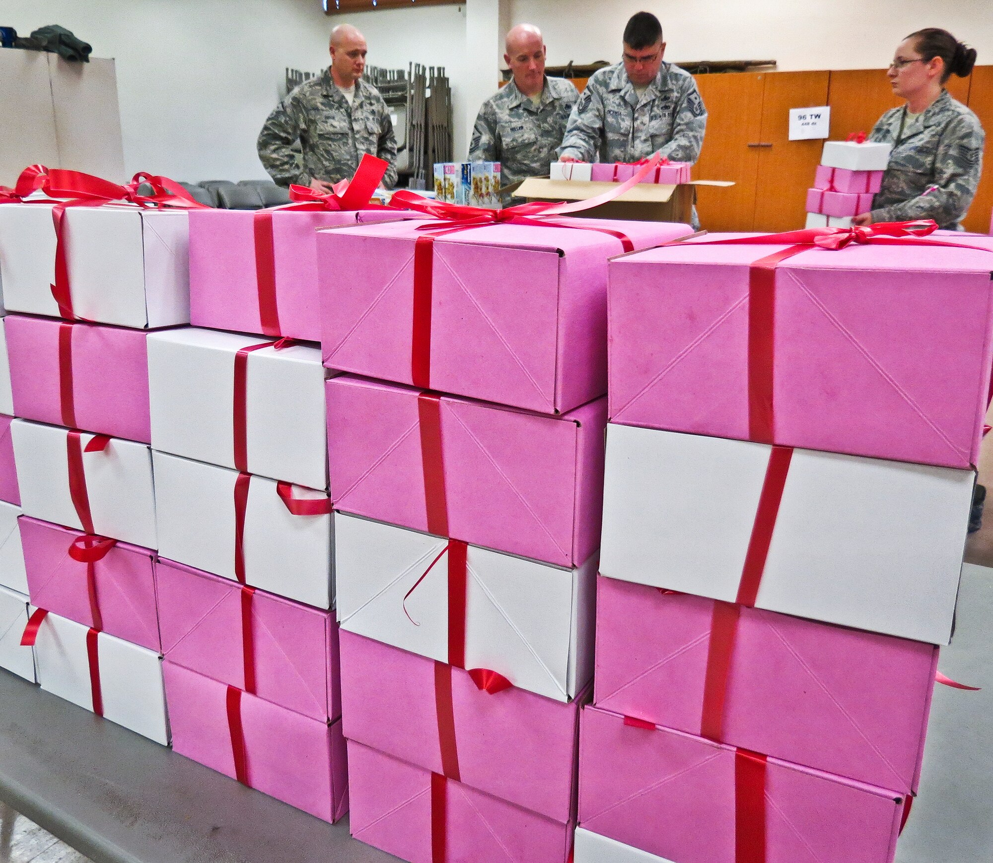 Team Eglin first sergeants prepare boxes of cookies during the annual Team Eglin Cookie Caper Dec. 17.  More than 650 dozen cookies were boxed up for Eglin's dorm residents.  (U.S. Air Force photo/Irene Freiberg)
