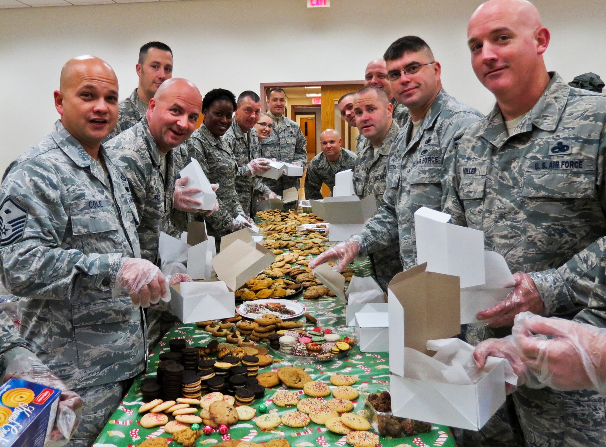 Team Eglin first sergeants prepare boxes of cookies during the annual Team Eglin Cookie Caper Dec. 17.  More than 650 dozen cookies were boxed up for Eglin's dorm residents.  (U.S. Air Force photo/Irene Freiberg)
