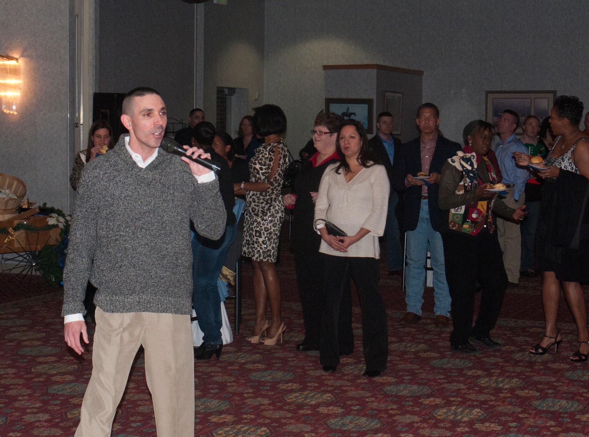 Chief Master Sgt. Shawn Drinkard, 90th Security Forces Group security forces manager, addresses partygoers, welcoming them to the 90th Missile Wing’s holiday party Dec. 14, 2013, in the Trail’s End Club. (U.S. Air Force photo by Airman 1st Class Jason Wiese)