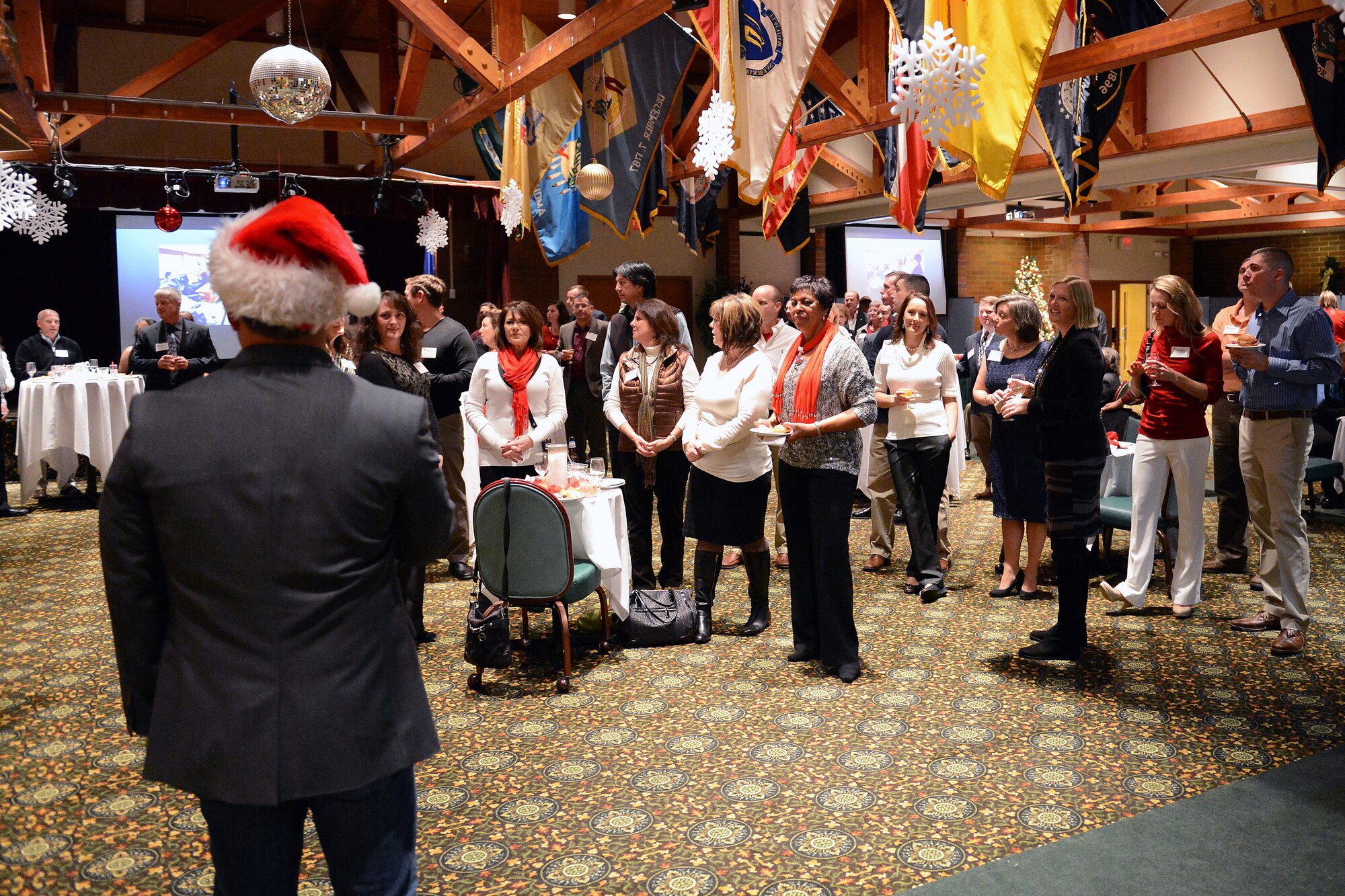 Col. David Kumashiro, 62nd Airlift Wing commander, thanks civic leaders and honorary commanders for their support at the annual holiday reception Dec. 15, at Joint Base Lewis-McChord, Wash. More than 100 civic leaders, honorary commanders and guests attended the event. (U.S. Air Force photo/ Airman 1st Class Jacob Jimenez) 
