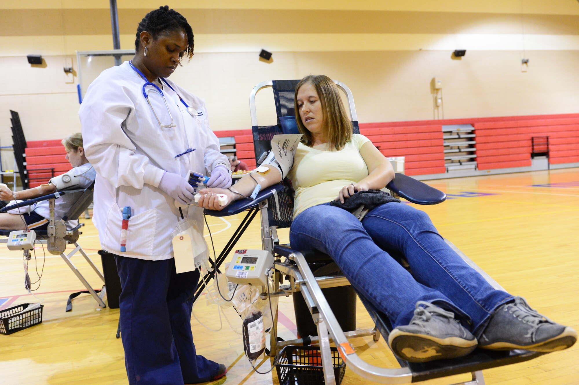 Brigette DeRosia, wife of Staff Sgt. Johnathon DeRosia, finishes her blood donation in the fitness center Dec. 12, 2013, at Shaw Air Force Base, S.C It takes approximately less than an hour to donate blood, and someone in America needs blood every two seconds. (U.S. Air Force photo by Airman 1st Class Diana M. Cossaboom/Released)
