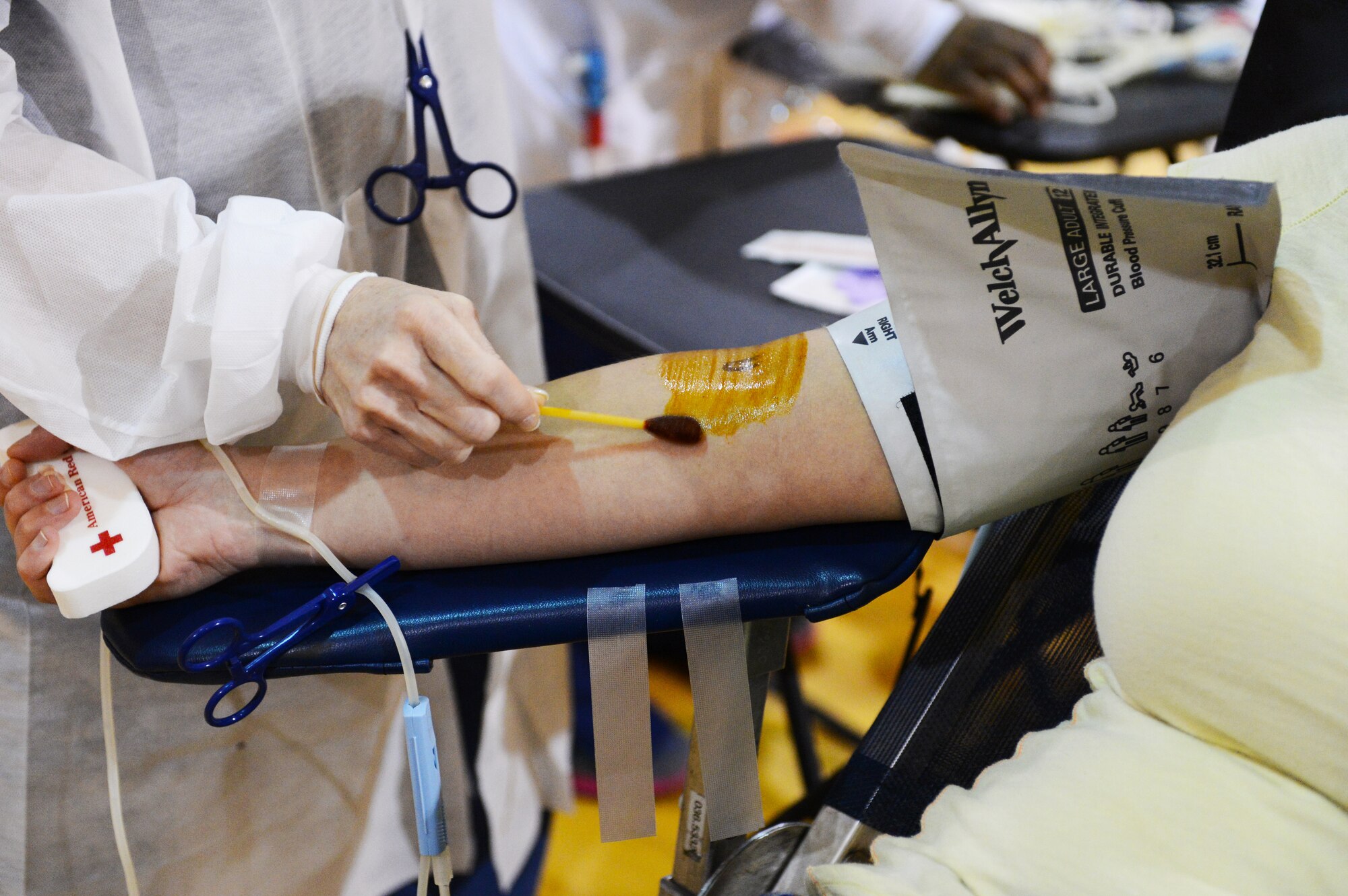 A donor is prepped during the blood drive in the fitness center Dec. 12, 2013, at Shaw Air Force Base, S.C. A pint of blood can save up to three lives, and Team Shaw donated 34 pints of blood. (U.S. Air Force photo by Airman 1st Class Diana M. Cossaboom/Released)