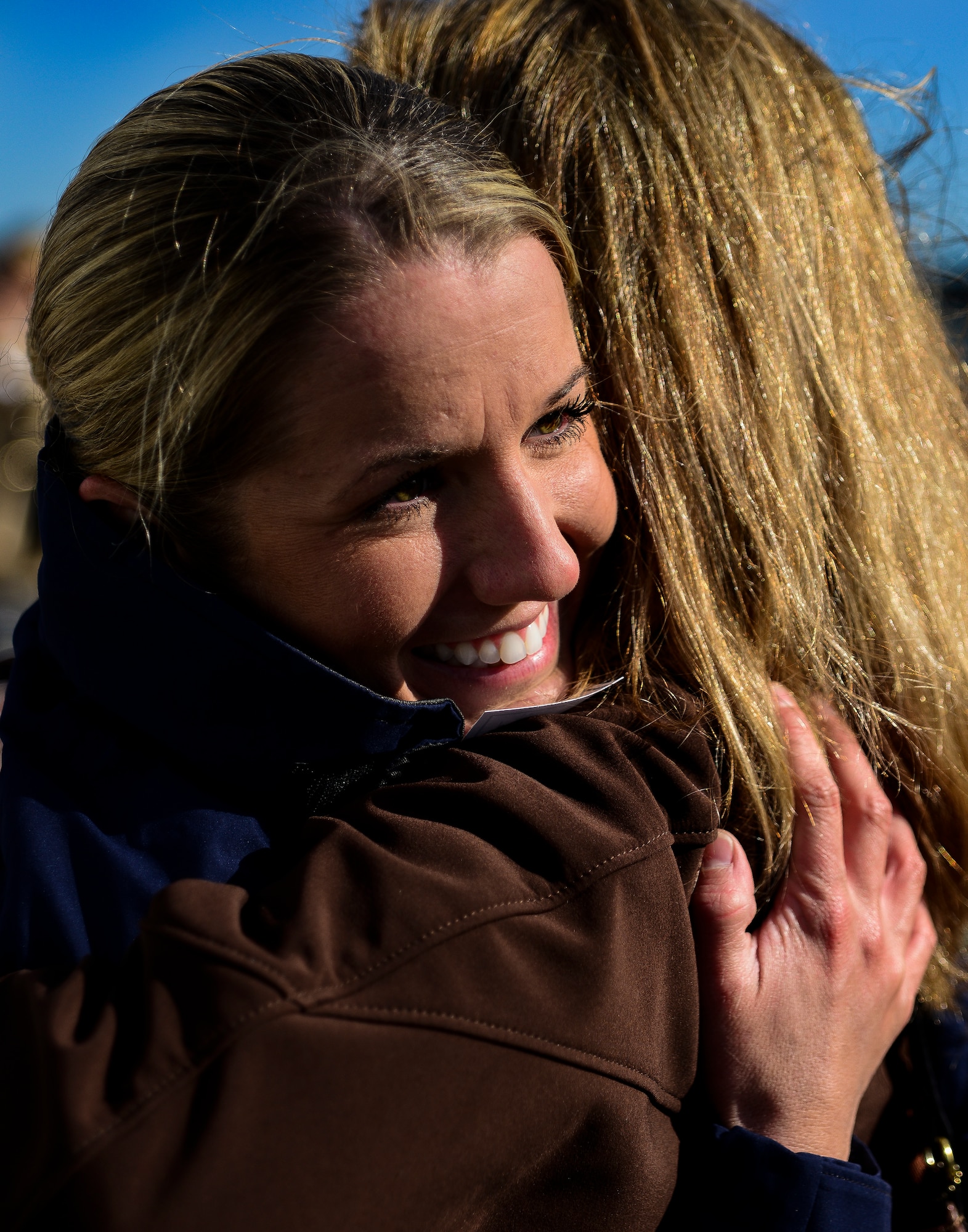 A Coastguardsman hugs her mother after returning from a three-month deployment on the USCGC Gallatin (WHEC 721), which returned from its final patrol Dec. 11, 2013, in Charleston, S.C. Gallatin’s crew seized more than 1,000 kilos of cocaine with a street value of $34 million. (U.S. Air Force photo/ Senior Airman Dennis Sloan)