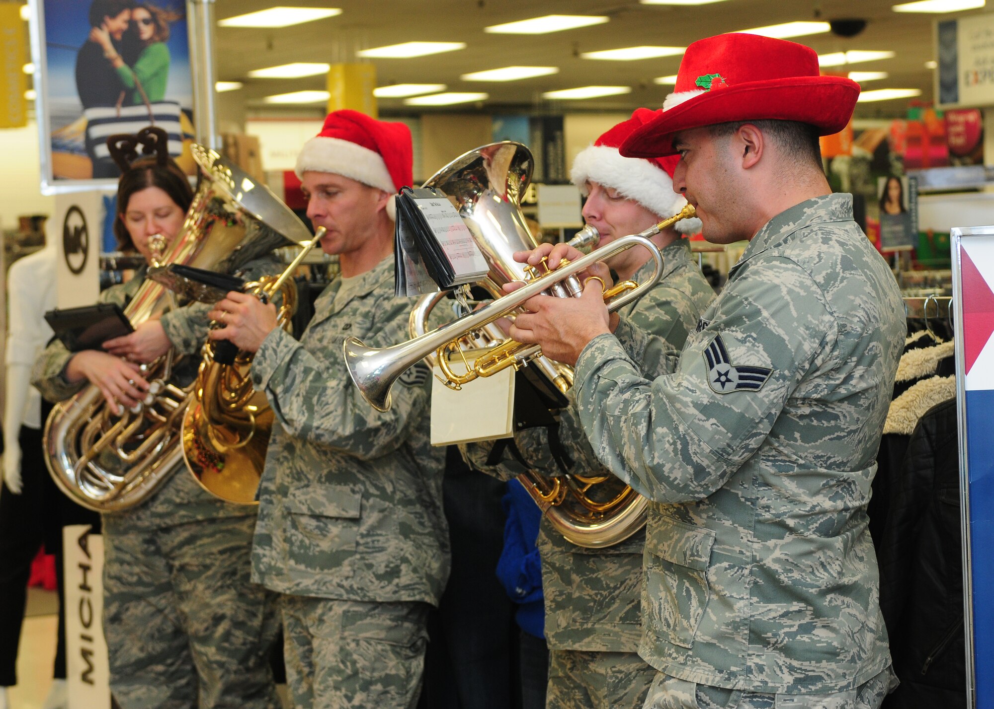 Members of the Travis Brass Band perform Christmas songs for Team Beale at the Base Exchange Dec. 13, 2013. The ensemble is a part of the Band of the Golden West based at Travis Air Force Base, Calif. (U.S. Air Force photo by Senior Airman Allen Pollard/Released) 