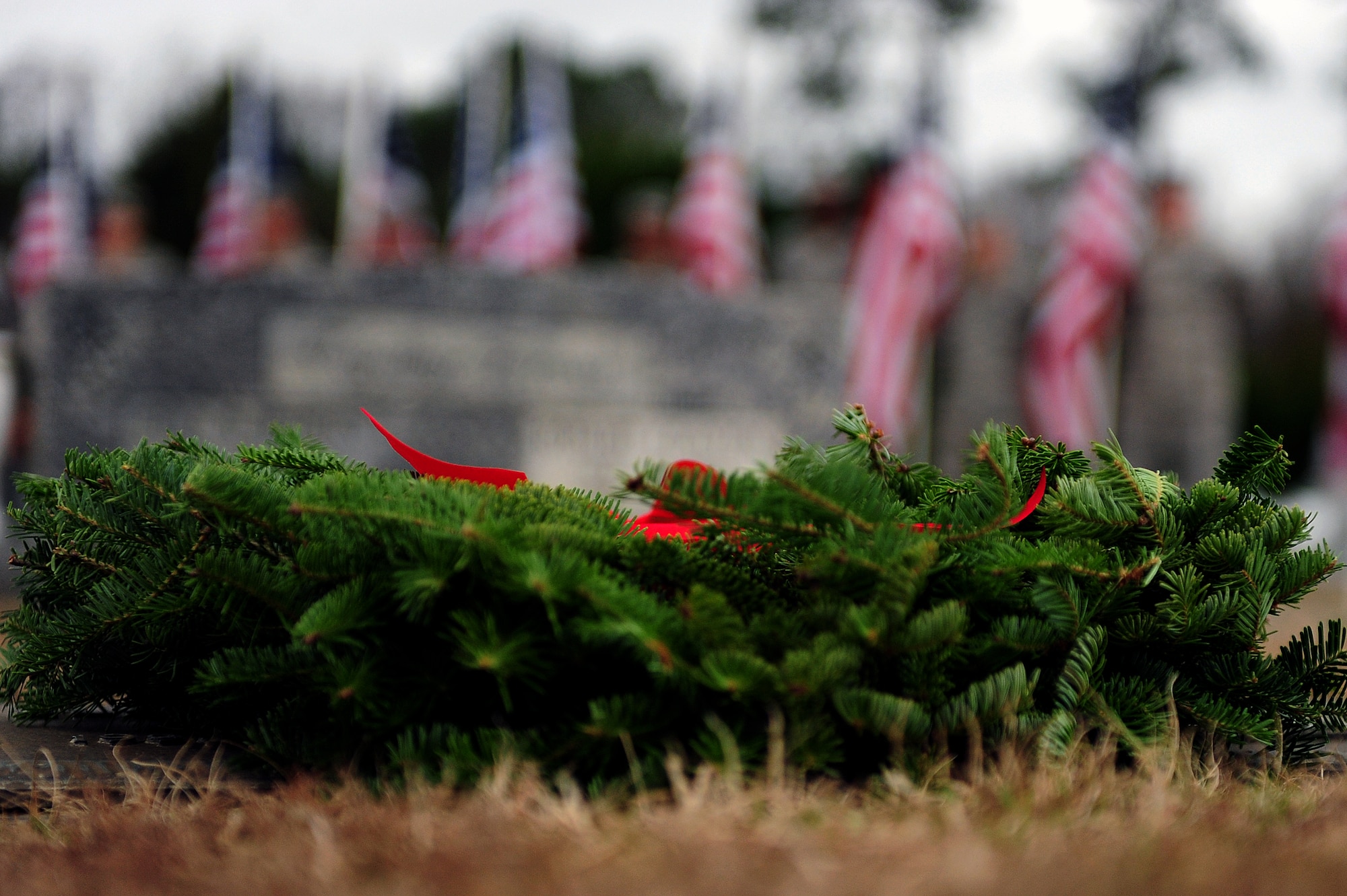 A wreath lies on the gravesite of an armed services veteran during a wreath-laying ceremony at Evergreen Memorial Cemetery, Goldsboro, N.C., Dec. 14, 2013.  The event was part of the Wreaths Across America mission, which delivered more than 540,000 remembrance wreaths to 908 cemeteries across the country in honor of our nation’s veterans.  (U.S. Air Force photo by Airman 1st Class Brittain Crolley)