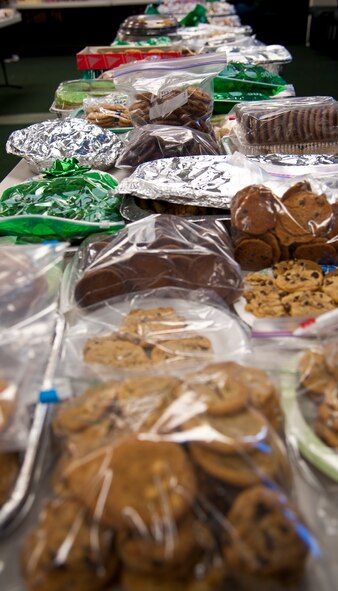 A variety of cookies line the table during the Commando Cookie Drop at the chapel on Hurlburt Field, Fla., Dec. 16, 2013. Volunteers donated cookies for about 1,000 Airmen living in the dorms. (U.S. Air Force photo/Senior Airman Michelle Vickers) 