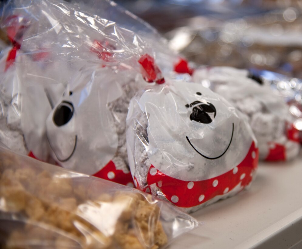 Bagged treats line a table for the Commando Cookie Drop at the chapel on Hurlburt Field, Fla., Dec. 16, 2013. Volunteers baked more than 9,000 cookies to distribute to Airmen living in the dorms. (U.S. Air Force photo/Senior Airman Michelle Vickers) 