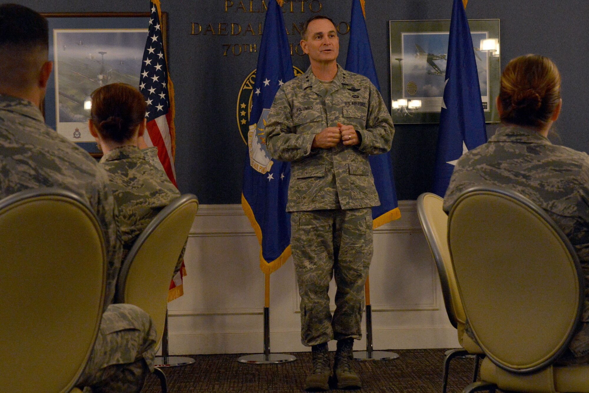 U.S. Air Force Maj. Gen. Jake Polumbo, Ninth Air Force commander speaks to senior noncommissioned officers at Shaw Air Force Base, S.C., Dec. 12, 2013. Polumbo spoke on the current Air Force climate and took time to answer questions and receive feedback. Master Sgt. Kate Harris, 20th Communications Squadron cyber operations section chief, commented, “I enjoyed his refreshing candidness on subjects like ‘strong supervision’, force shaping motives, and Shaw's multiple events that have put the base in the media's spotlight.” Polumbo offered guidance on making tough calls and setting the bar high along with following through on holding Airmen accountable at all levels. (U.S. Air Force photo/ Senior Airman Ashley L. Gardner/Released)