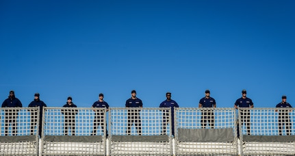United States Coast Guardsmen stand at parade onboard the national security cutter Gallatin (WHEC 721) as it moors pier side Dec. 11, 2013, in Charleston, S.C. During the ship’s final patrol, Gallatin’s crew seized more than 1,000 kilos of cocaine with a street value of $34 million. (U.S. Air Force photo/ Senior Airman Dennis Sloan)