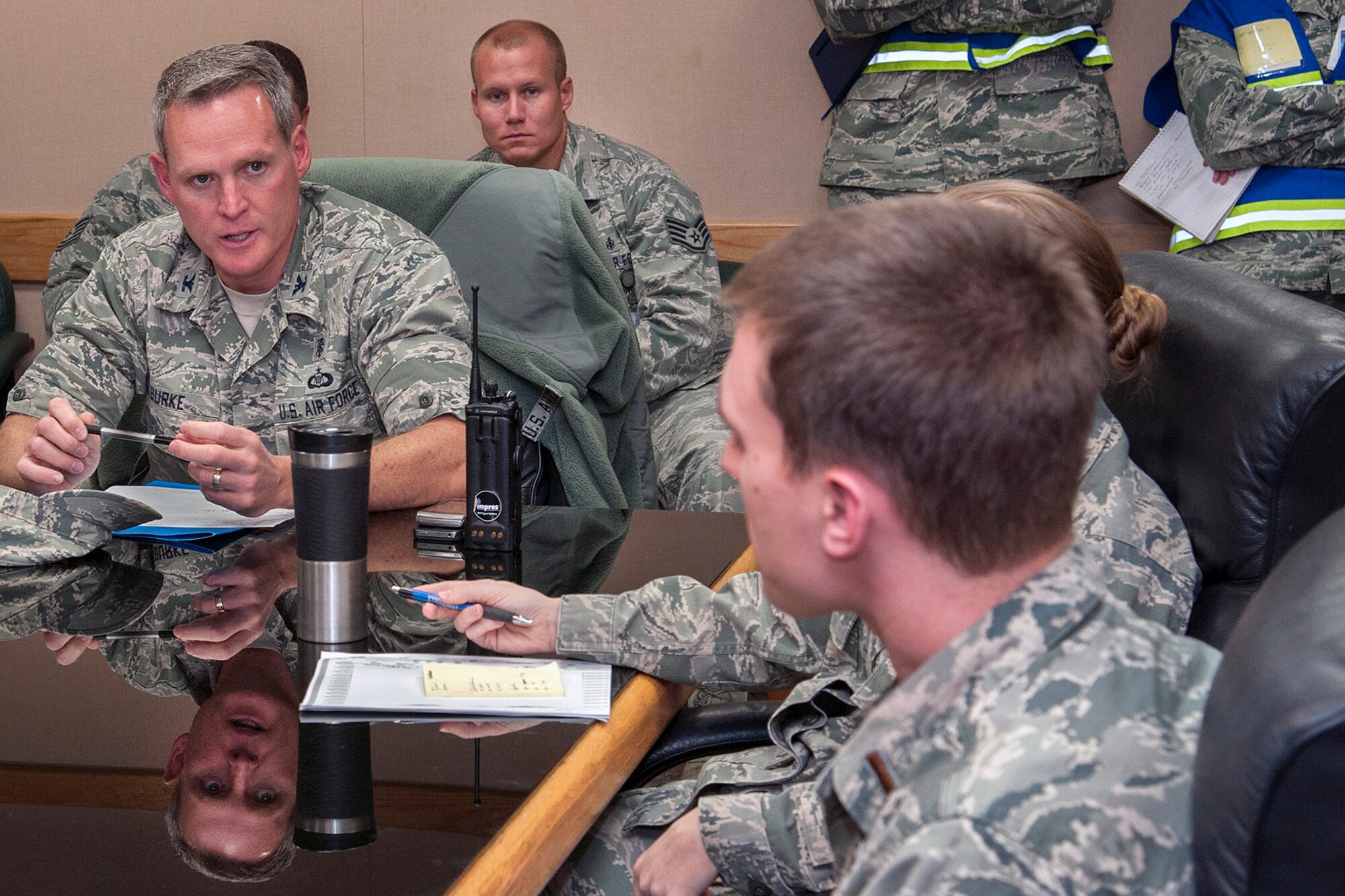 PETERSON AIR FORCE BASE, Colo. – Col. Michael Burke, 21st Medical Group commander, calls a meeting Dec. 4 with medical team chiefs and discusses the next step in responding to an exercise scenario where influenza developed in the Pacific and swept the country. It was affecting enough of Colorado Springs and the base that all the response elements were swamped. The 21st MDG set up vaccine distribution points at Peterson, Schriever Air Force Base and Cheyenne Mountain Air Force Station, and countered the threat by prioritizing the administration of limited preventive medicine. (U.S. Air Force photo/Craig Denton)
