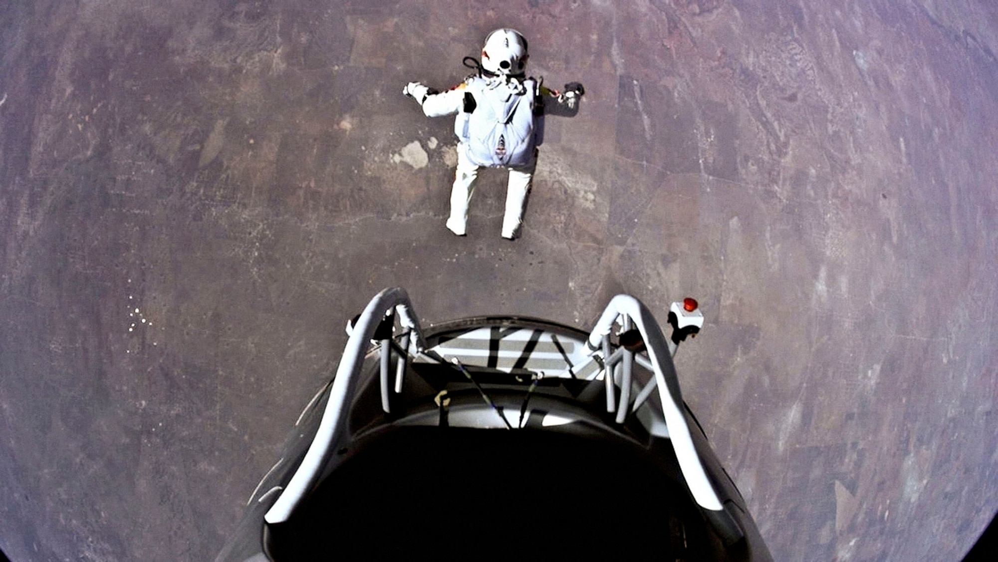 Pilot Felix Baumgartner of Austria jumps out from the capsule during the final manned flight for Red Bull Stratos in Roswell, N.M., on Oct. 14, 2012. The Red Bull Stratos exhibit will be on display at the National Museum of the U.S. Air Force from Jan. 24-March 16, 2014. (Photo courtesy of Red Bull Stratos)