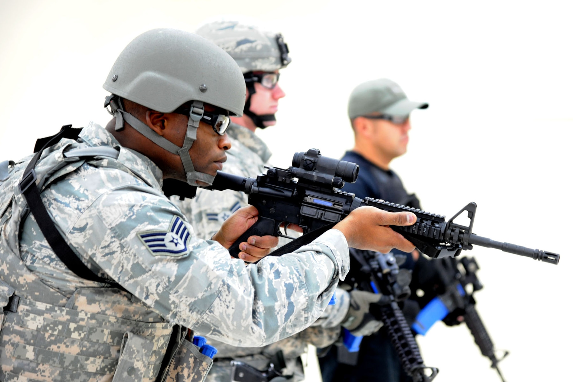 PETERSON AIR FORCE BASE, Colo. – Staff Sgt. Anthony Brodie, 21st Security Forces Squadron unit trainer, readies himself for a live-fire drill during a Shoot, Move, Communicate course on Peterson AFB Dec. 4. The purpose of the exercise, a standardized Air Force practice, is to prepare security forces members to effectively adapt and respond to one another while reacting to enemy fire, especially in a deployed environment. (U.S. Air Force photo/ Staff Sgt. J. Aaron Breeden)