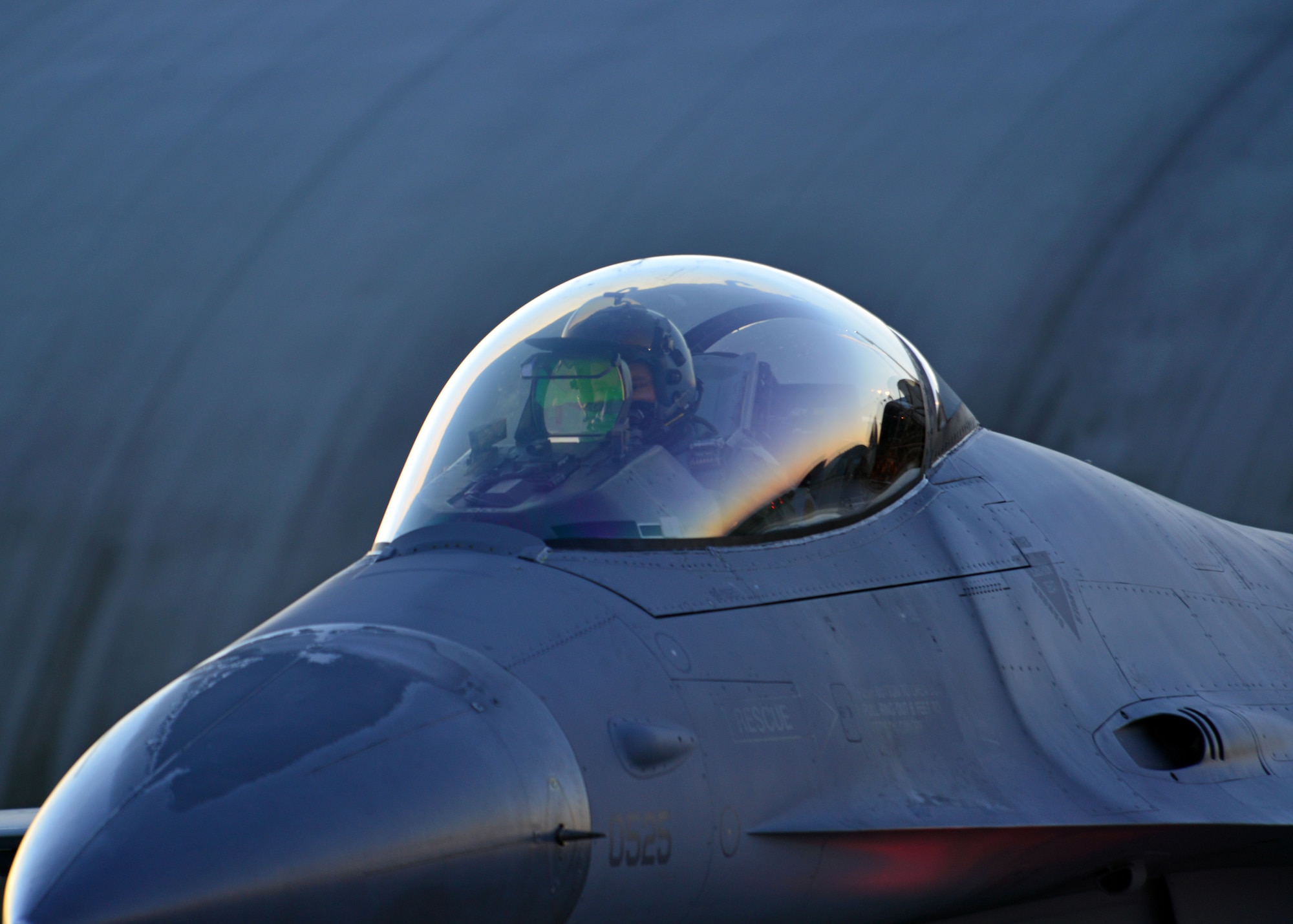 An F-16 Fighting Falcon pilot taxies to the flightline for takeoff during a close air support training exercise, Dec. 17, 2013, at Aviano Air Base, Italy. During the exercise, Aviano pilots fly as low as 1,000 feet and communicate with joint terminal attack controllers on the ground, who call in the simulated air strikes. The exercise requires coordination and corporation with the 31st Security Forces Squadron, 31st Maintenance Squadron and the 31st Aircraft Maintenance Squadron. (U.S. Air Force photo/Senior Airman Briana Jones) 