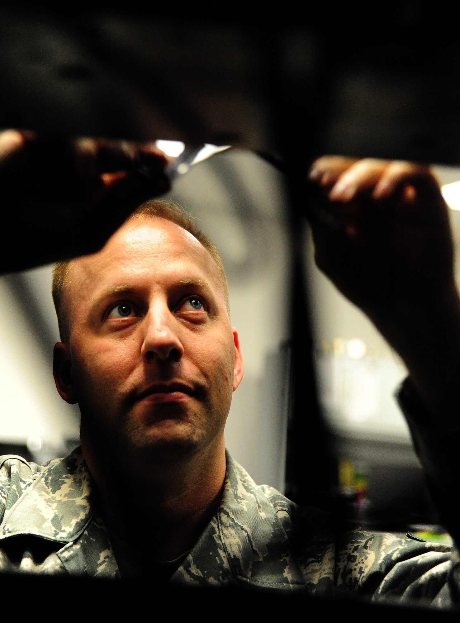 Tech. Sgt. Brian Edwards, 509th Communications Squadron NCO in charge of network infrastructure, activates network ports at Whiteman Air Force Base, Mo., Dec. 5, 2013. This allows a device to securely connect to the Internet. (U.S. Air Force photo by Staff Sgt. Nick Wilson/Released)