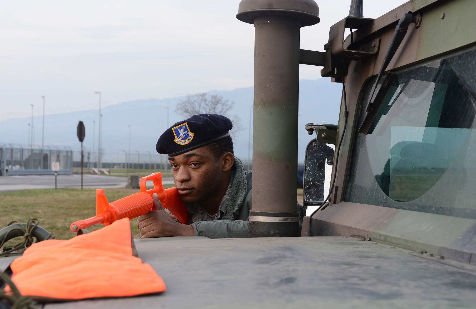 Airman 1st Class Darius Vaughn, 31st Security Forces Squadron defender, prepares to fire on enemy forces during a close air support training exercise, Dec. 9, 2013, at Aviano Air Base, Italy.  This training used the coordination between ground troops and military aircraft to maximize the impact on ground warfare. (U.S. Air Force photo/Airman 1st Class Deana Heitzman)