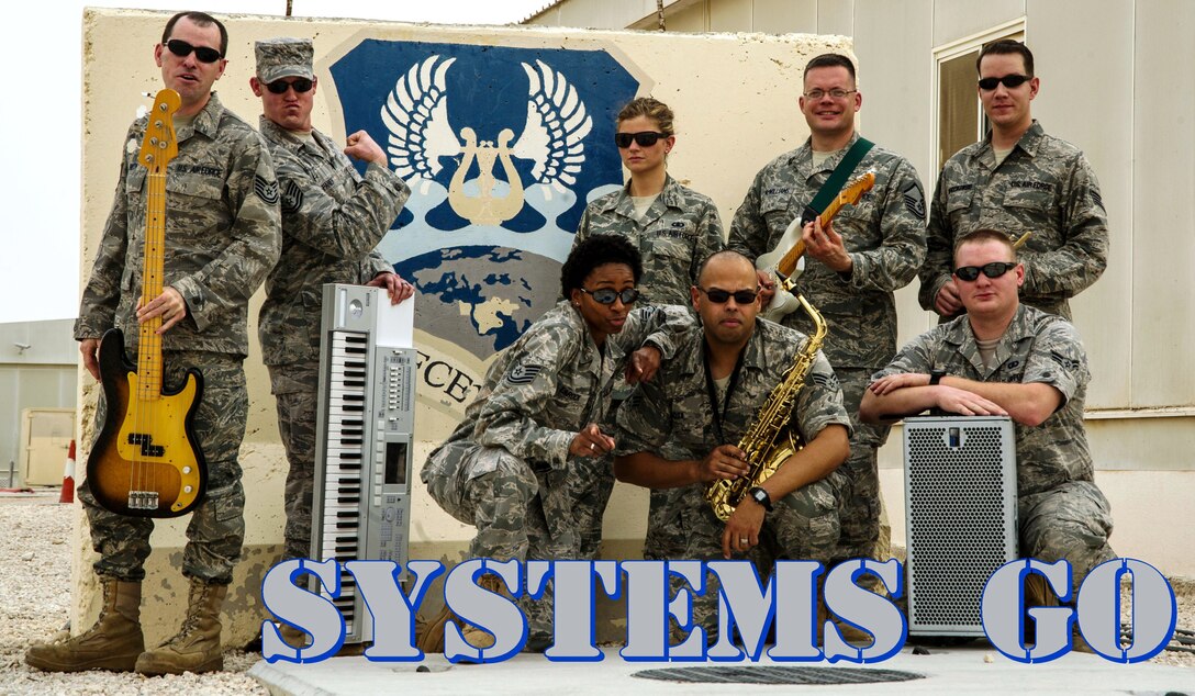 U.S. Air Forces Central Band the "Systems Go" pose for a photo in Southwest Asia.  These musicians perform and tour in small ensembles throughout the area of responsibility to positively promote troop, morale, diplomacy and outreach to host nation communities. (U.S. Air Force photo/Staff Sgt. Stephanie Richards)