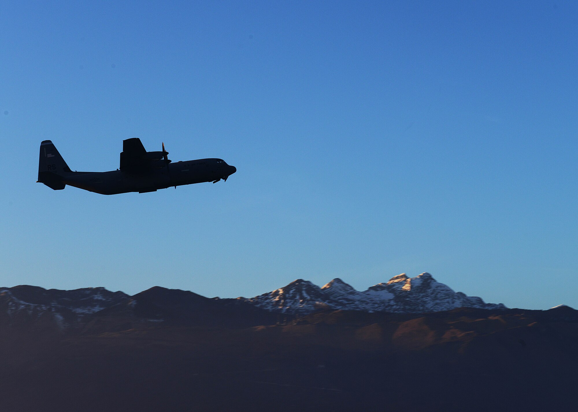 A C-130 Hercules takes off from the flightline carrying both Army and Air Force paratroopers, Dec. 11, 2013, at Aviano Air Base, Italy. The Hercules is the prime transport for airdropping troops and equipment into hostile areas. (U.S. Air Force photo/Airman Ryan Conroy) 