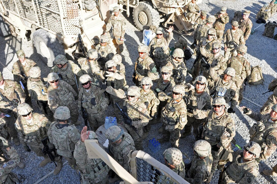 U.S. soldiers receive movement orders at the motor pool on Camp Phoenix