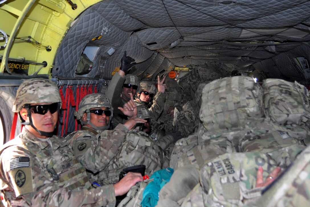 U.S. Army Sgt. Michaelangelo S. Lejano, left, U.S. Army Spcs. Jesse M ...