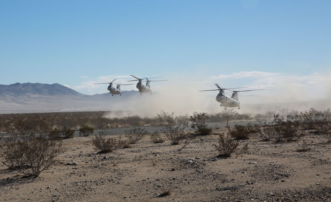 Three CH-46 Sea Knight helicopters prepare to drop off Marines during an air raid in support of Exercise Steel Knight 2014 at Marine Corps Air Ground Combat Center Twentynine Palms, Calif., Dec. 11th, 2013. After landing, the Marines set up blocking positions and secured the airfield. The training developed important skills and tactics necessary for their upcoming deployment to Australia. Steel Knight is an annual exercise that includes elements from the entire I Marine Expeditionary Force that focuses on conventional operations and provides realistic training that prepares Marines for overseas operations. (Marine Corps photo by Lance Cpl. Jonathan Boynes/Released)