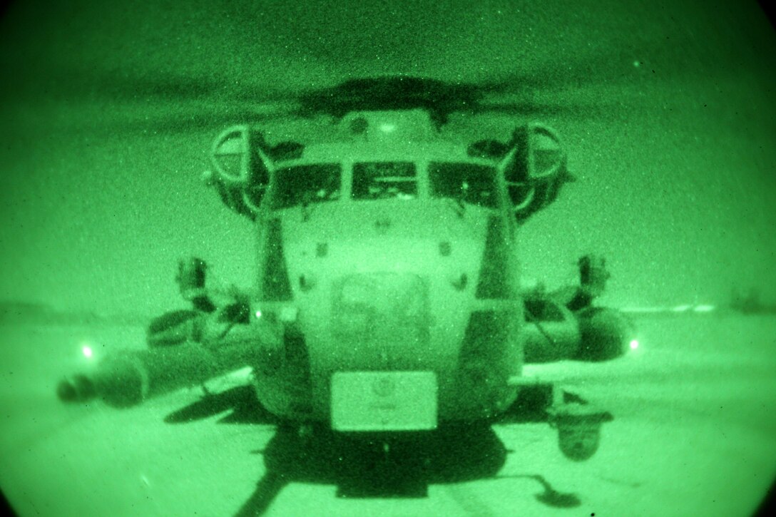 A CH-53E Super Stallion assigned to Marine Heavy Helicopter Squadron 462 (HMH-462) is stationed during an operation at Forward Operating Base Price, Helmand province, Afghanistan, Dec. 17, 2013. HMH-462 provided aerial support for British forces with Task Force Helmand during an operation in Kharotan. (U.S. Marine Corps photo by Sgt. Gabriela Garcia/Released)
