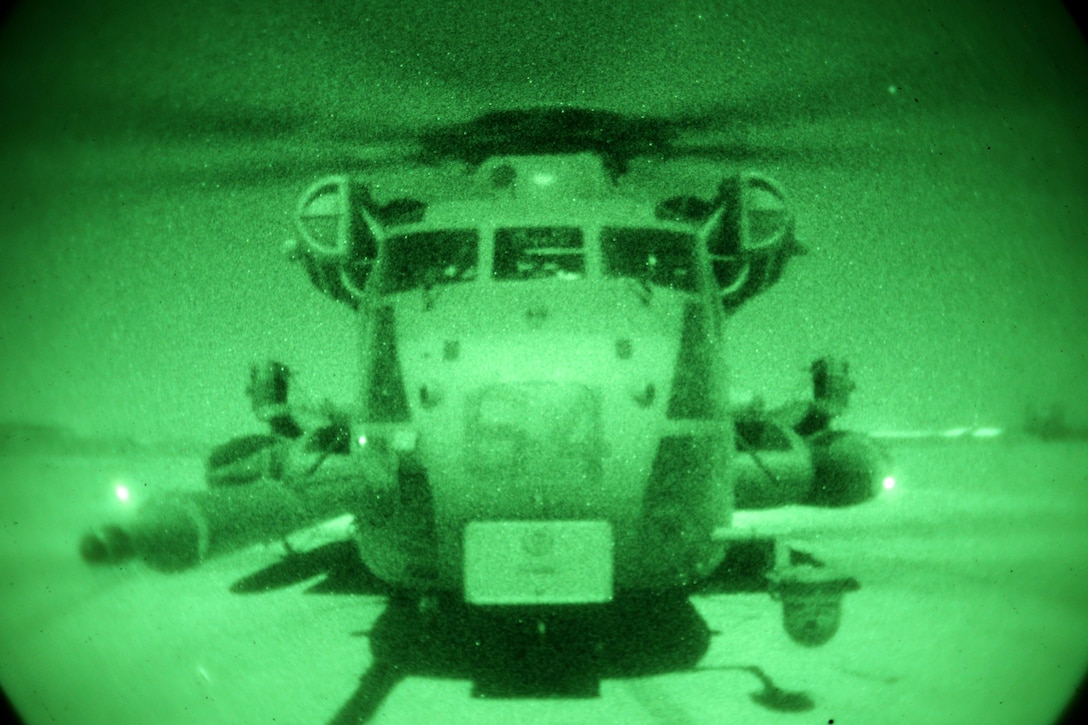 A CH-53E Super Stallion assigned to Marine Heavy Helicopter Squadron 462 (HMH-462) is stationed during an operation at Forward Operating Base Price, Helmand province, Afghanistan, Dec. 17, 2013. HMH-462 provided aerial support for British forces with Task Force Helmand during an operation in Kharotan. (U.S. Marine Corps photo by Sgt. Gabriela Garcia/Released)