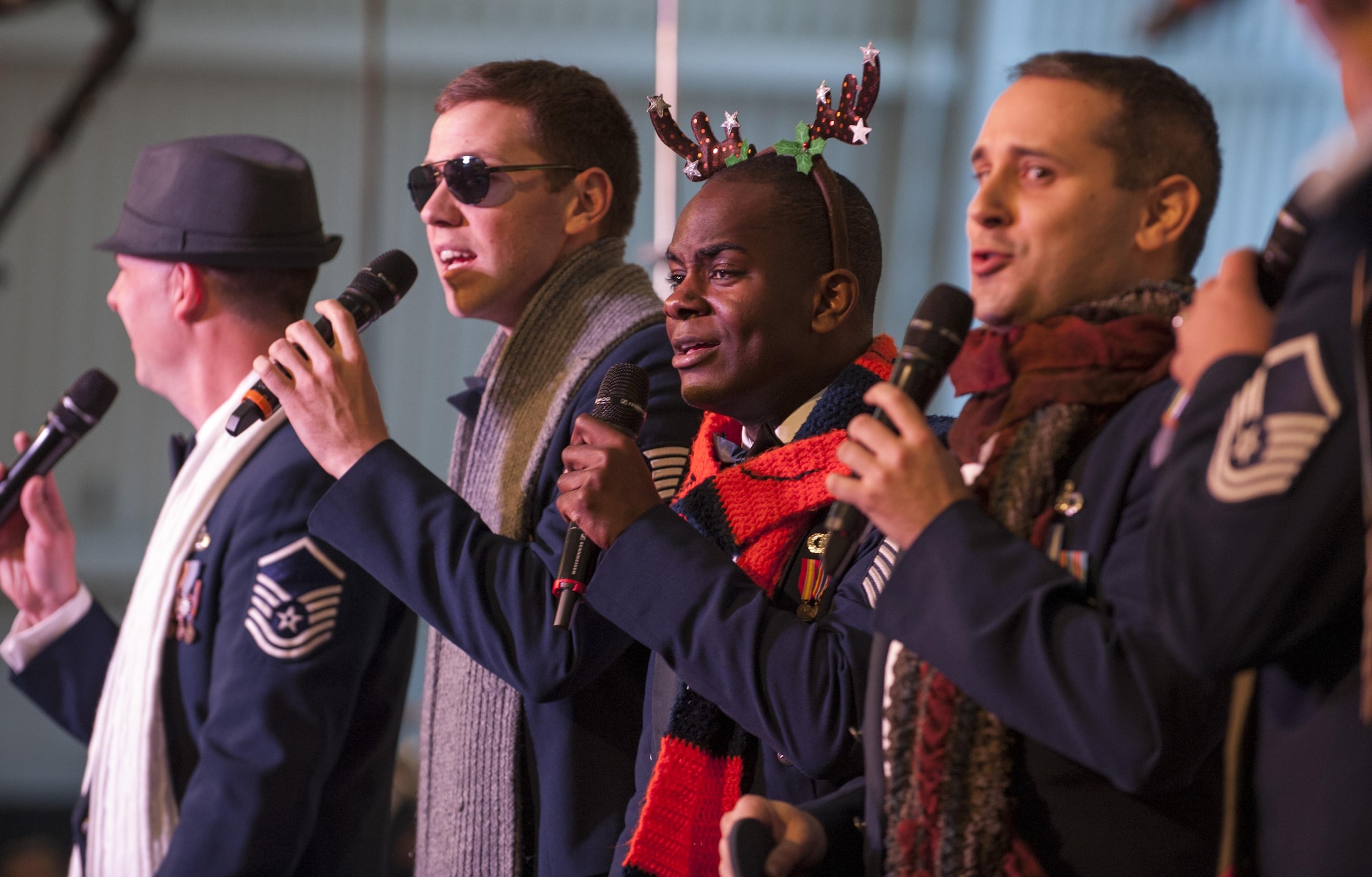 The U.S. Air Force Band men’s chorus performs the 12 Days of Christmas during a holiday concert Dec. 15, 2013, at the Smithsonian National Air and Space Museum, Udvar-Hazy Center, Chantilly, Va. Thousands of visitors to the museum attended the concert after seeing the Air Force Band’s viral video on the internet of a “flash mob” at the Air and Space museum on the National Mall. (U.S. Air Force photo/Staff Sgt. Carlin Leslie)