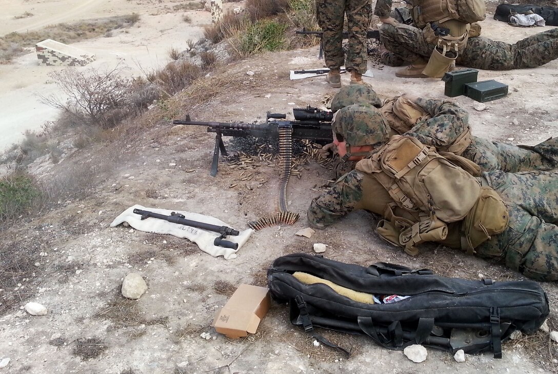 Marines with Special-Purpose Marine Air-Ground Task Force Crisis Response fire an M240B machine gun during a bilateral live-fire range with Spanish Brigada De La Legion Rey Alfonso XIII aboard Base Alvarez de Sotomayor, Almeria, Spain, Dec. 2, 2013. The bilateral exercise, conducted Dec. 2-5, allowed the Marines to refresh their weapon skills while building rapport with a foreign military partner. SPMAGTF Crisis Response is a self-mobile, self-sustaining force capable of responding to a range of crises to protect both U.S. and partner-nation security interests in the region, while also strengthening partnerships throughout the U.S. European Command and U.S. Africa Command area of responsibility.