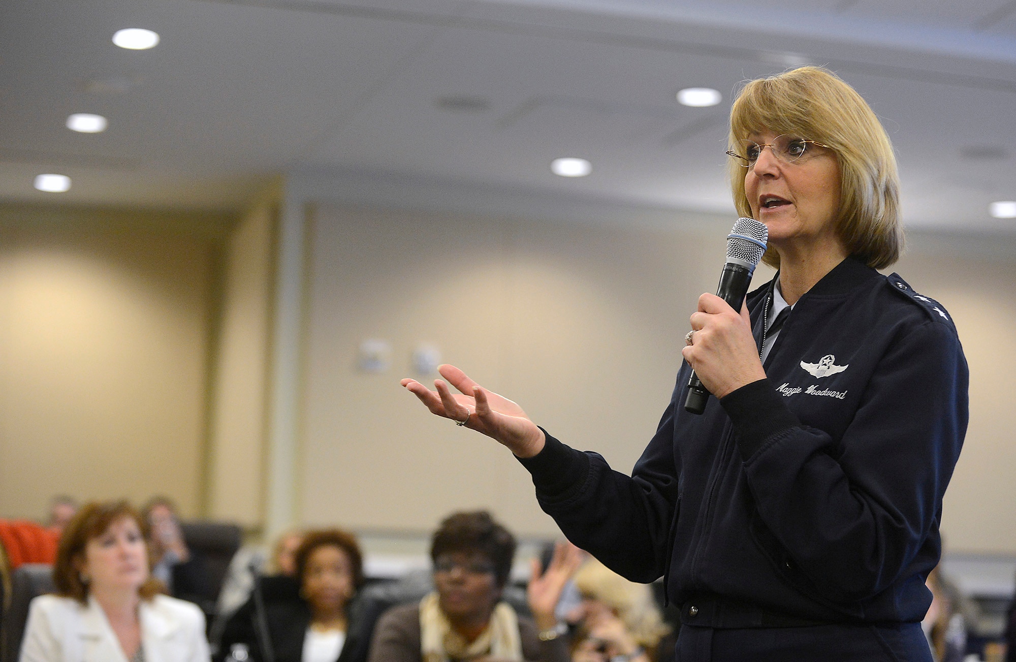 Maj. Gen. Margaret H. Woodward, director of the Air Force Sexual Assault Prevention and Response office, talks with sexual assault response coordinators during the SAPR summit, hosted by Air Force Chief of Staff Gen. Mark A. Welsh III, at Joint Base Andrews, Md., Dec. 12, 2013.  Wing commanders, command chiefs and sexual assault response coordinators from across the Air Force attended the two-day event, which included discussion from senior leaders, sexual assault victims and industry experts.  