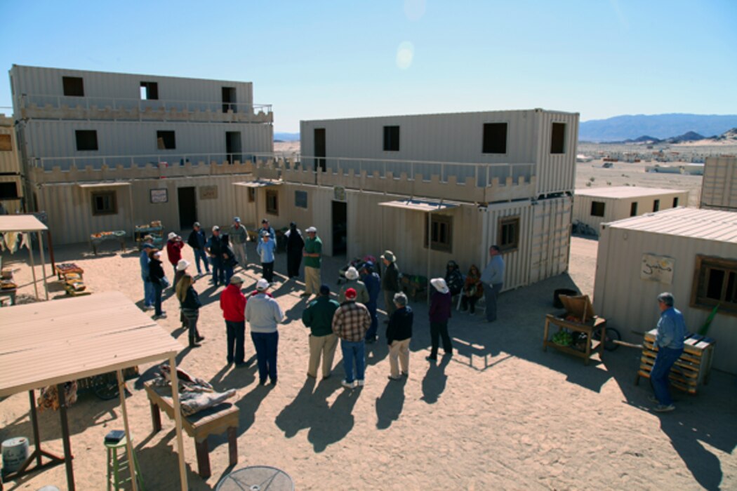 Tour participants learn how Marines and sailors train in urban environments during a visit to Range 200, one of several MOUT — Military Operations in Urban Terrain — training ranges aboard the Combat Center.