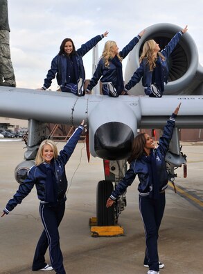 Members of the Dallas Cowboys Cheerleaders pose on an A-10 Thunderbolt II during their holiday United Services Organization tour while visiting the flight line at Osan Air Base, Republic of Korea, Dec. 18, 2013. The cheerleaders also held a cheer clinic at the Osan High School. (U.S. Air Force photo/Staff Sgt. Emerson Nuñez)
