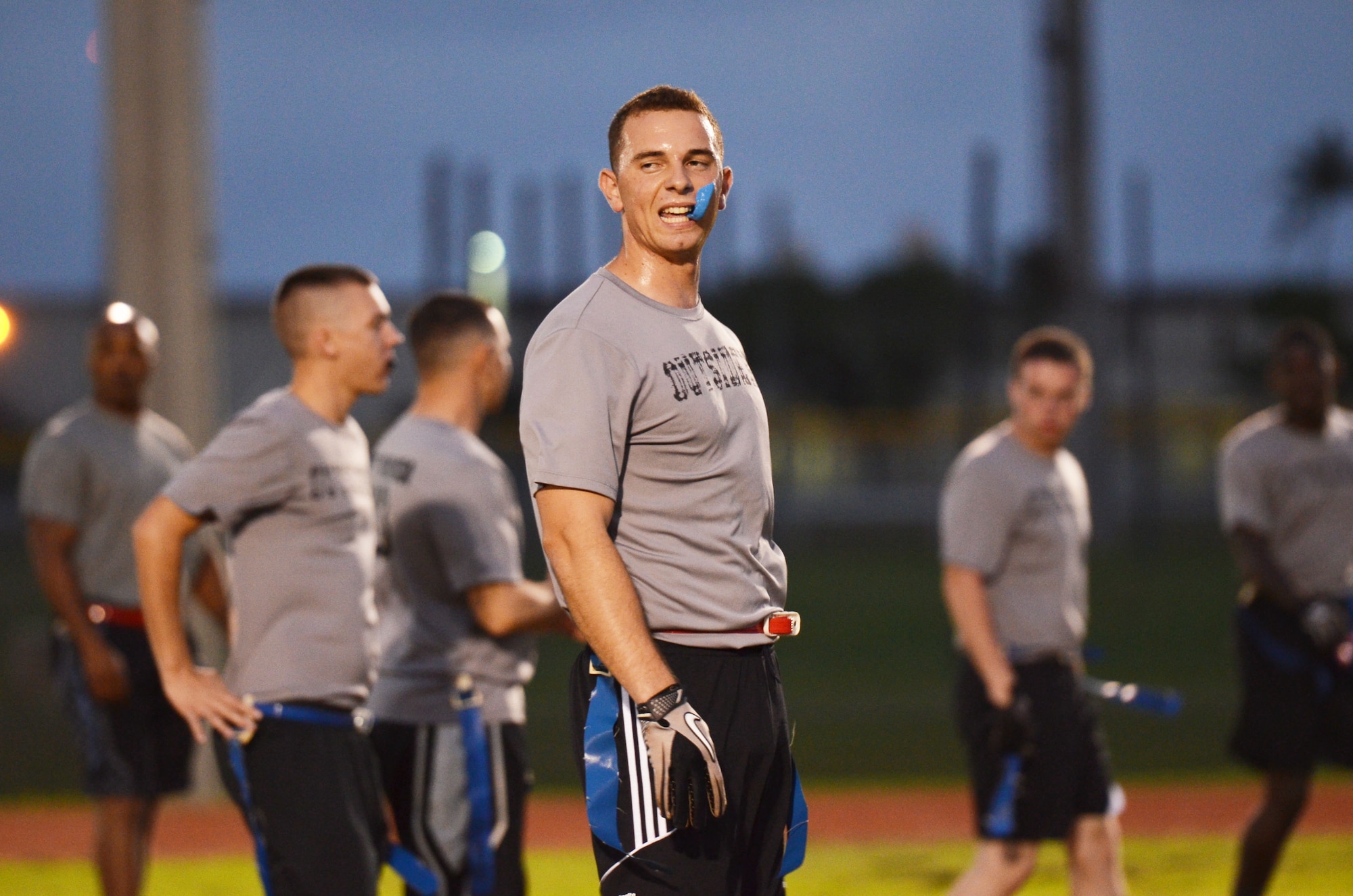 Jamal Asaad, 36th Logistics Readiness Squadron, gets ready for a play during an intramural football game between 36th LRS and 36th Force Support Squadron on Andersen Air Force Base, Guam, Dec. 19, 2013. 36th FSS was defeated by 36th LRS 21-0. (U.S. Air Force photo by Airman 1st Class Mariah Haddenham/Released)