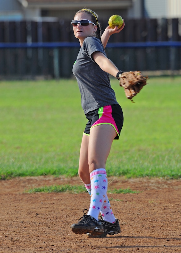 A Joint Base Pearl Harbor-Hickam spouse prepares to pitch during the 2nd Annual Super Draft Softball Tournament, at Joint Base Pearl Harbor-Hickam, Hawaii, Dec. 14, 2013. The JBPHH Air Force Sergeant’s Association hosted the event where all the registration fees collected were donated to the Wounded Warrior Project and all the participants also donated a toy to “Toys for Tots.”  (U.S. Air Force photo/Master Sgt. Jerome S. Tayborn)