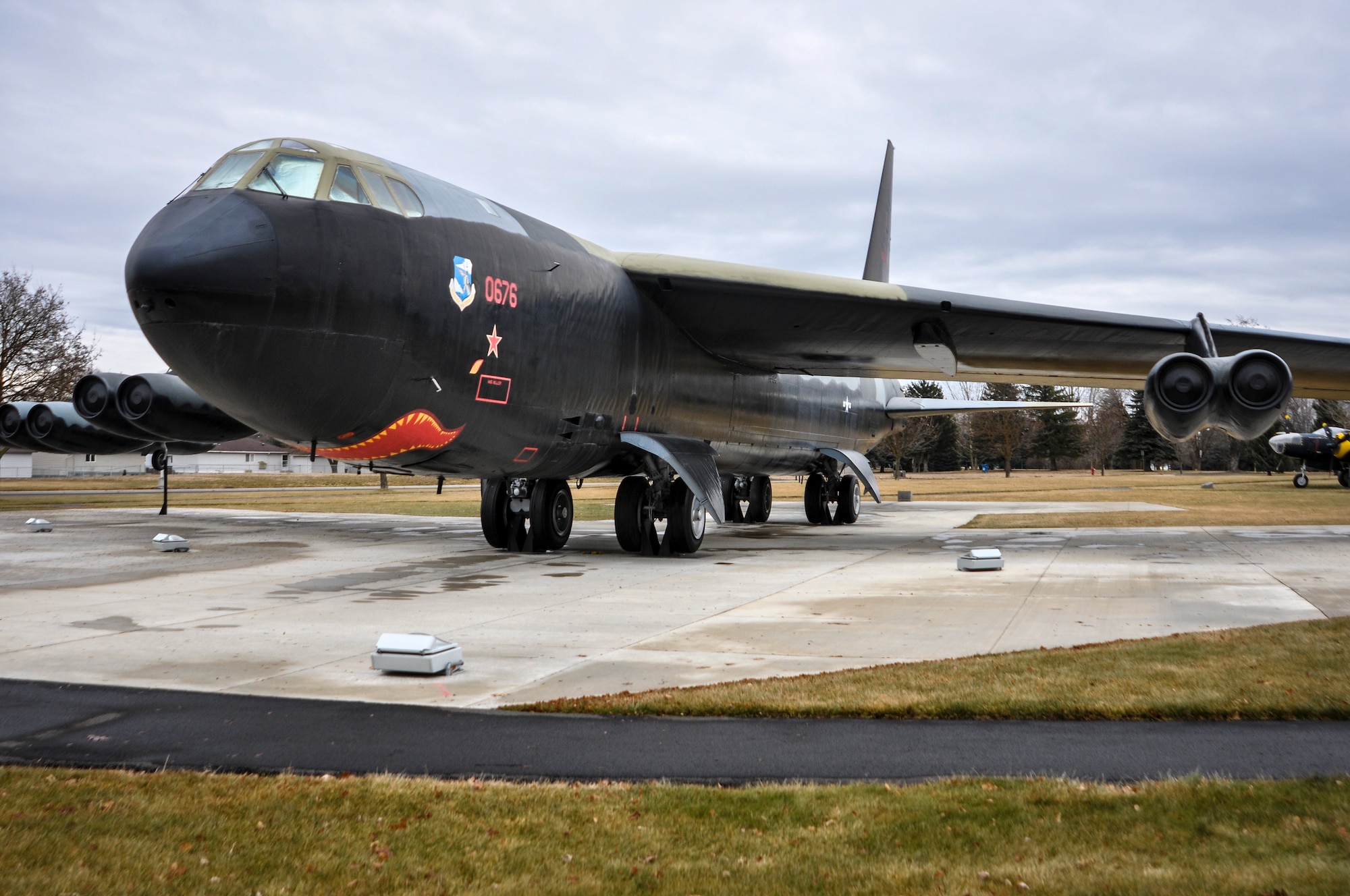 A B-52 Stratofortress static display, tail “676,” sits dominantly at the Fairchild Air Force Base, Wash., Heritage Park Dec. 18, 2013. The same day in 1972, during Linebacker II operations over North Vietnam, “676” became the first B-52 to shoot down an enemy MiG aircraft. The tail gunner, Staff Sgt. Samuel O. Turner, fired his 50-caliber machine guns at a MiG-21 as it moved in to attack the B-52. Turner reported a “gigantic explosion to the rear of the aircraft” and was credited with being the first tail gunner to log a confirmed kill during combat in a B-52. (U.S. Air Force photo by Scott King/Released)