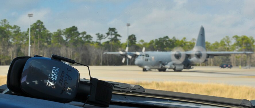 Hearing protection sits on the dashboard of a vehicle on Hurlburt Field, Fla., Dec. 6, 2013. Line delivery drivers wear hearing protection during ammo loading to prevent hearing damage. (U.S. Air Force photo/Staff Sgt. John Bainter)