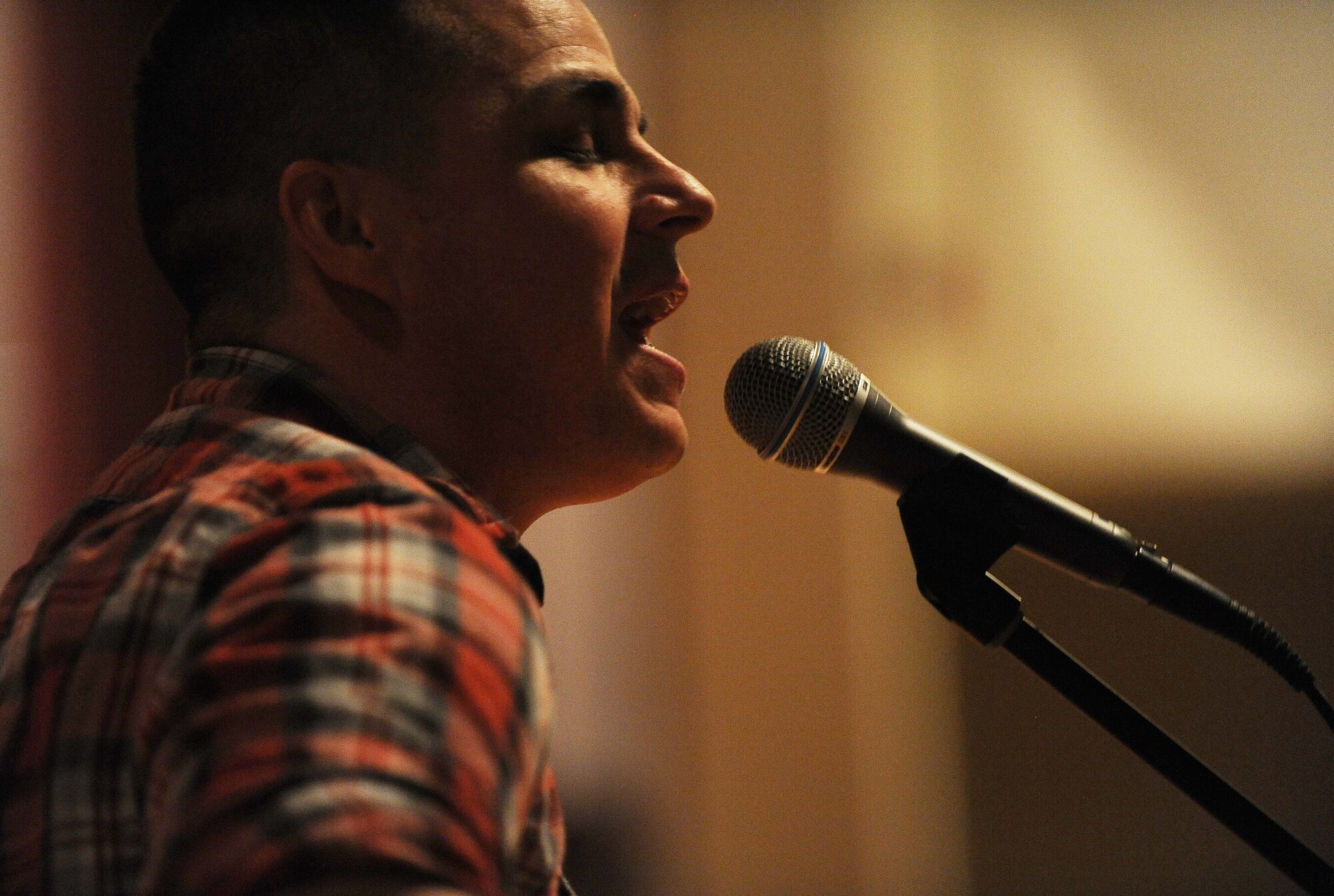 Minot Air Force Base hosted its first base-wide talent show at the base theater here Friday, Dec. 13, 2013. The show consisted of eight acts, including singing, dancing, spoken word, and yo-yoing. The judging panel, which included CMSgt Kevin Jurgella, command chief of the 5th Bomb Wing and CMSgt Felicia Noil, command chief for the 91st Missile Wing, judged each act and gave their critiques. Of the eight performances, first, second, and third place were awarded to three competitors, each with a monetary prize.  (U.S. Air Force photos/ Airman 1st Class Lauren Pitts)