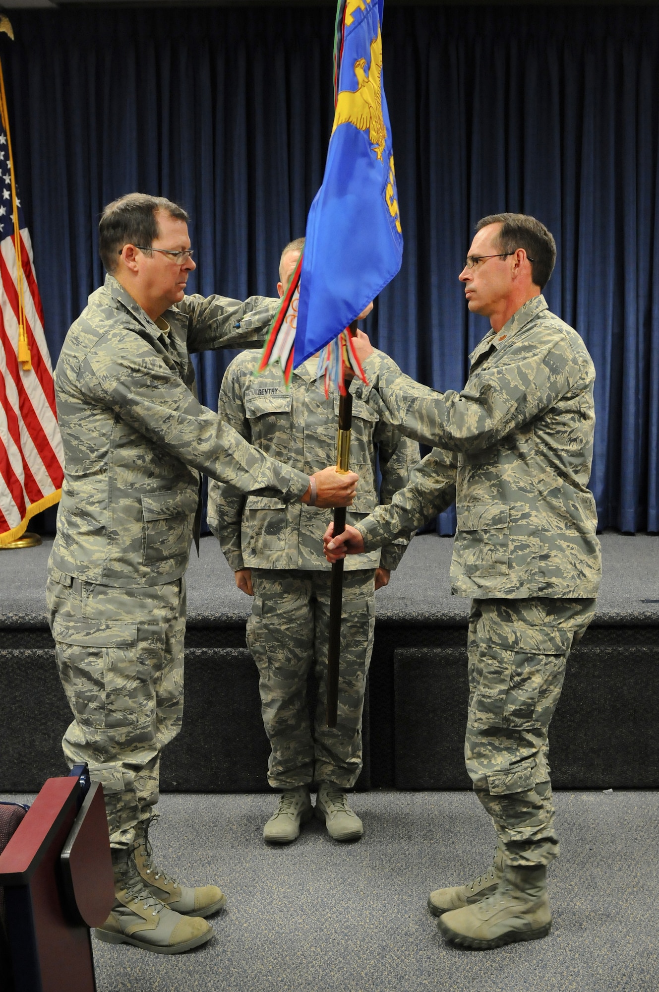 Col. Robert Hamm (left), commander of the 123rd Operations Group, presents the guidon of the 123rd Special Tactics Squadron to Maj. Sean McLane, the unit's new commander, during a change-of-command ceremony held at the Kentucky Air National Guard Base in Louisville, Ky., Nov. 24, 2013. The passing of the guidon is a time-honored tradition signifying change of leadership. (U.S. Air National Guard photo by Staff Sgt. Vicky Spesard)