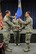 Col. Robert Hamm (left), commander of the 123rd Operations Group, presents the guidon of the 123rd Special Tactics Squadron to Maj. Sean McLane, the unit's new commander, during a change-of-command ceremony held at the Kentucky Air National Guard Base in Louisville, Ky., Nov. 24, 2013. The passing of the guidon is a time-honored tradition signifying change of leadership. (U.S. Air National Guard photo by Staff Sgt. Vicky Spesard)