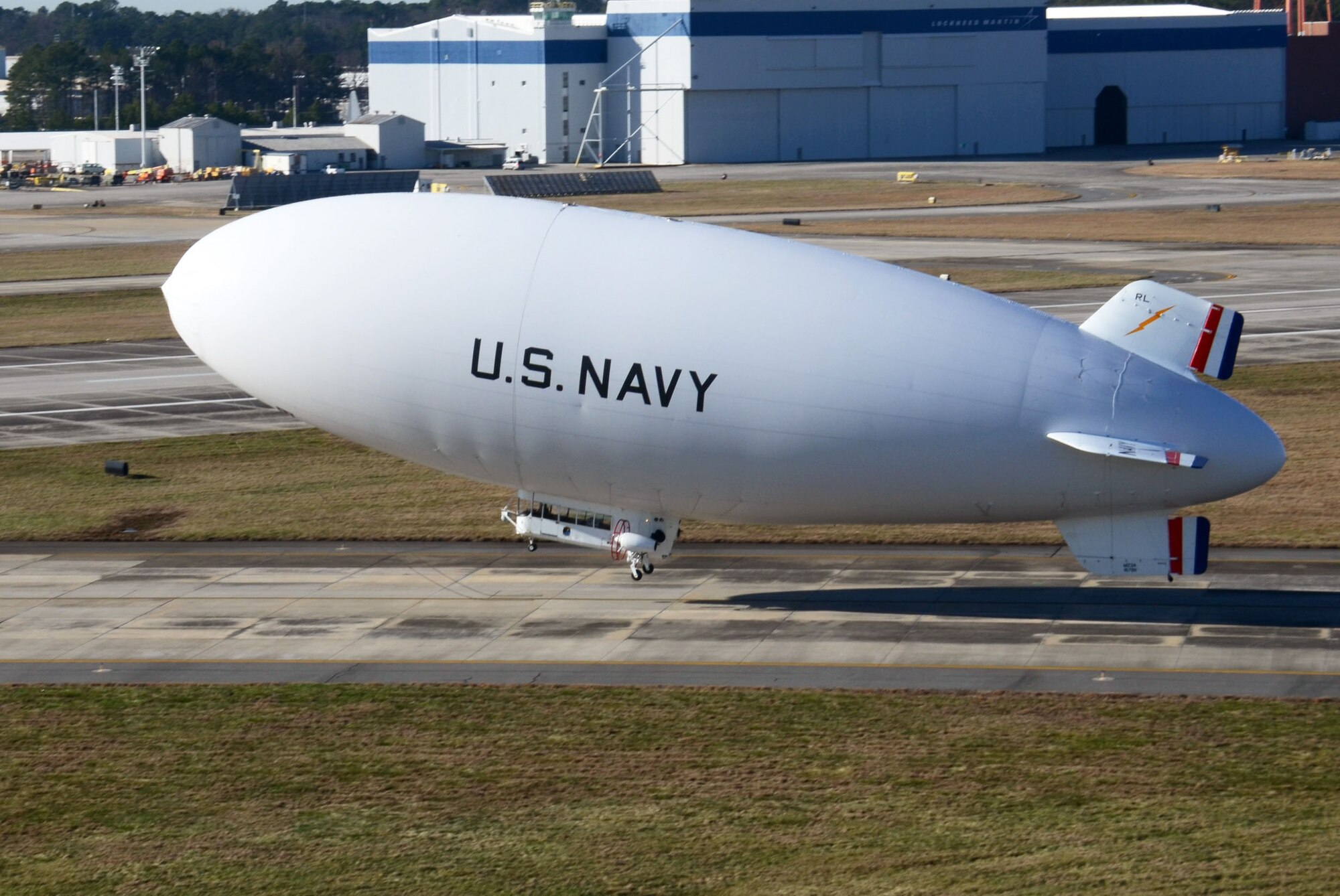 The United States Navy manned airship, MZ-3A lifts off the runway at Dobbins Air Reserve Base, Ga. Dec. 17. The Navy’s only airship based at Patuxent River, Md., stopped at Dobbins on its way to a winter location in central Florida, so that scientists from Georgia Institute of Technology Research facility could take measurements for systems integration work Dec. 14-16. (U.S. Air Force photo/Don Peek)