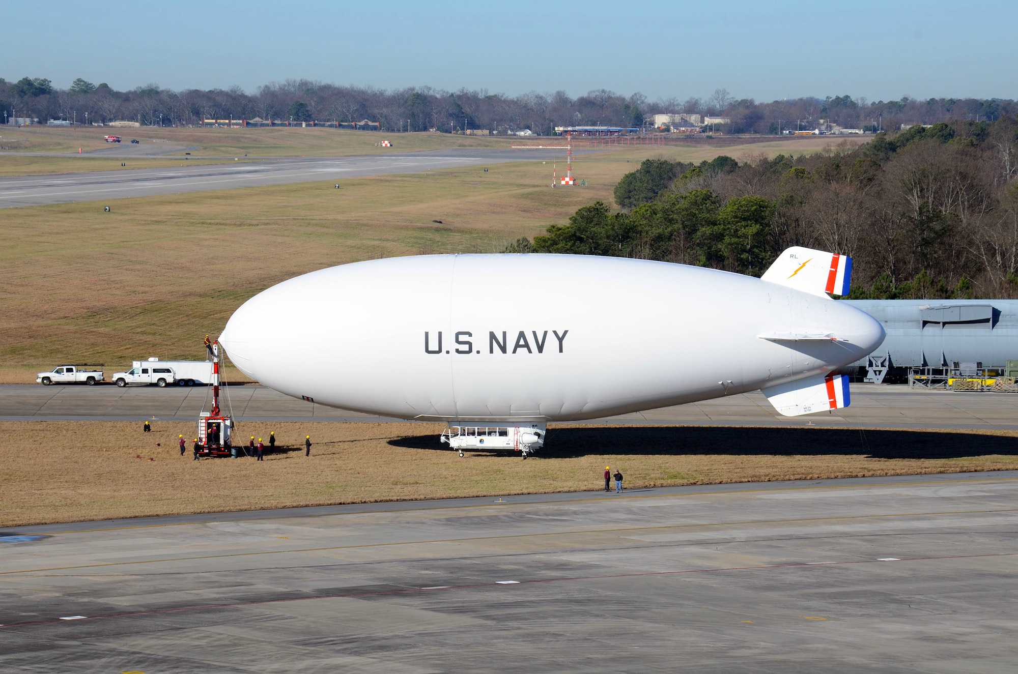 The United States Navy manned airship, MZ-3A prepares to depart Dobbins Air Reserve Base, Ga. Dec. 17. The Navy’s only airship based at Patuxent River, Md., stopped at Dobbins on its way to a winter location in central Florida, so that scientists from Georgia Institute of Technology Research facility could take measurements for systems integration work Dec. 14-16. (U.S. Air Force photo/Don Peek)