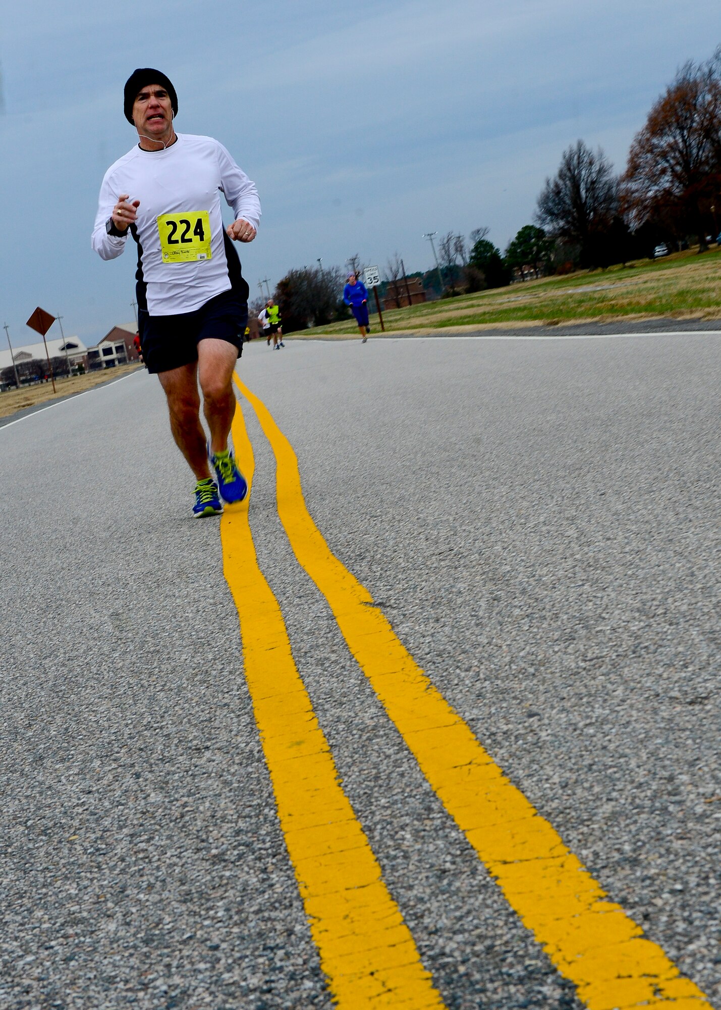 U.S. Air Force Col. David Crow, Air Combat Command installation and mission support Expeditionary Combat Support Division chief runs during 4th annual “Race 'Round the Base” at Langley Air Force Base, Va., Dec. 14, 2013. More than 100 runners from Joint Base Langley-Eustis and the surrounding area participated in the event. (U.S. Air Force photo by Staff Sgt. John D. Strong II/Released)
