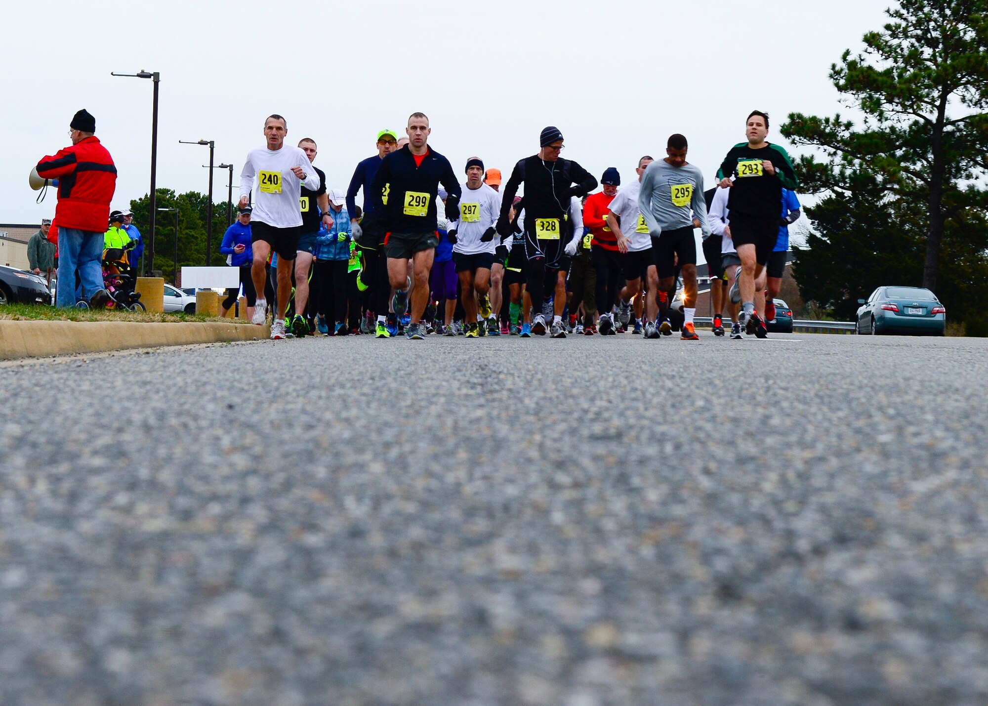 Participants run during the 4th annual “Race 'Round the Base” at Langley Air Force Base, Va., Dec. 14, 2013. The 10-mile race took participants through different areas of Langley. (U.S. Air Force photo by Staff Sgt. John D. Strong II/Released)