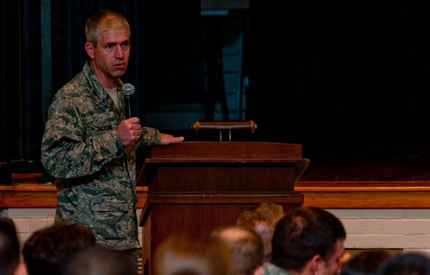 Col. Joel Jackson, 22nd Air Refueling Wing commander, responds to a question during a town hall meeting Dec. 17, 2013, at McConnell Air Force Base. Jackson hosted three of these meetings to discuss the details of upcoming force shaping measures with the Airmen and civilians of Team McConnell. (U.S. Air Force photo/Airman 1st Class Victor J. Caputo)
