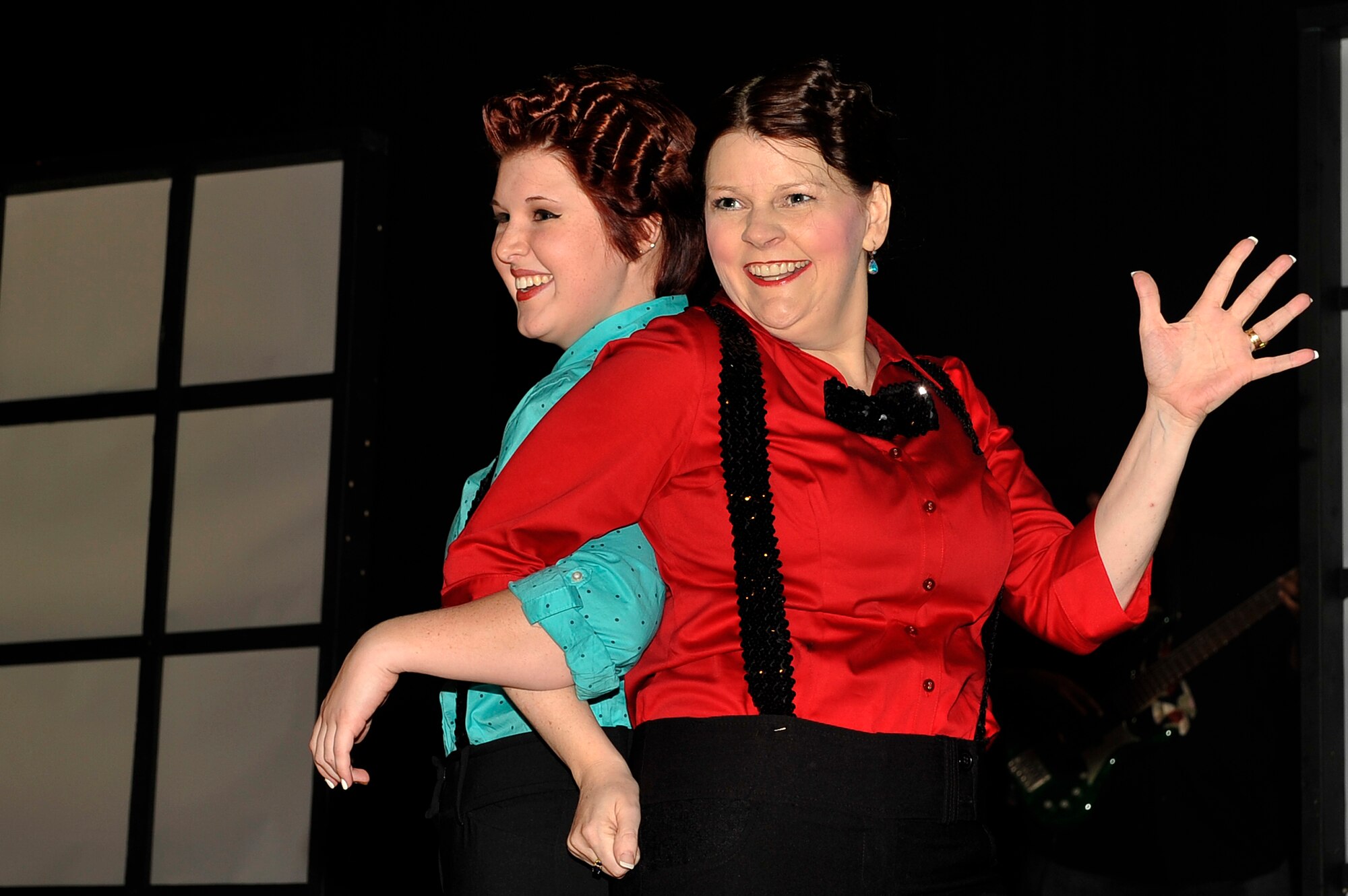 Kim White shares a moment after a tap dancing routine during a Christmas musical at Faith Family Church Dec. 6, 2013 Shiloh, Ill. White experienced a perforated colon in 2009, and is the first time she has danced in five years. White is the wife of Col. Timothy White who is assigned to Air Mobility Command. (U.S. Air Force photo/Airman 1st Class Jaeda Waffer)
