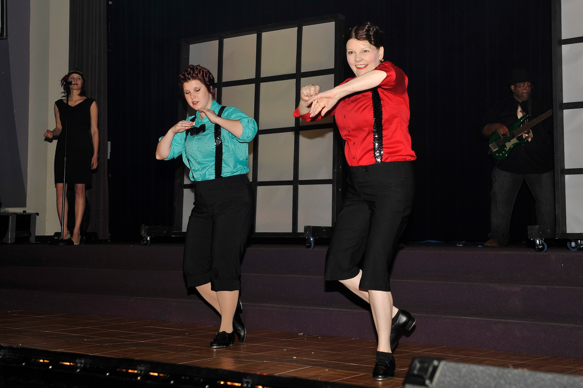 Kim White performs a tap dancing routine during a Christmas musical at Faith Family Church Dec. 6, 2013, Shiloh, Ill. White performed her routine for the first time in about five years, due to a perforated colon. White is the wife of Col. Timothy White who is assigned to Air Mobility Command. (U.S. Air Force photo/Airman 1st Class Jaeda Waffer)