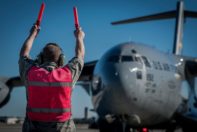 Master Sgt. Horace Bell, 315th Aircraft Maintenance Squadron crew chief, taxis in a C-17 Globemaster III Dec. 18, 2013, at Joint Base Charleston – Air Base, S.C. The aircraft, nicknamed the “Spirit of Charleston” was the first C-17 in the U.S. Air Force’s inventory and has flown missions throughout the world for more than two decades. Those missions have totaled more than 20,000 flight hours. (U.S. Air Force photo / Senior Airman Tom Brading)